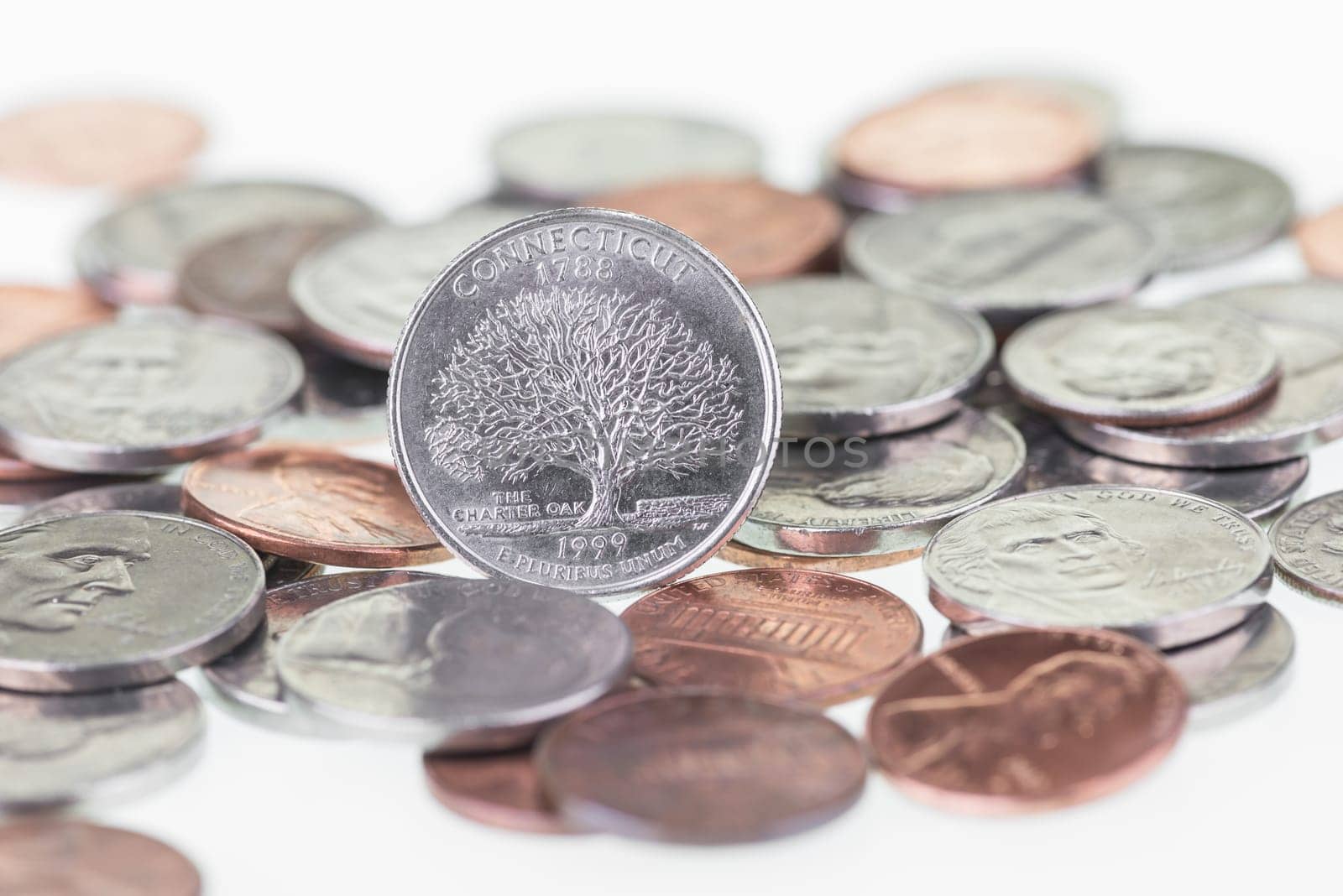 Connecticut State Quarter with other coins extreme close up