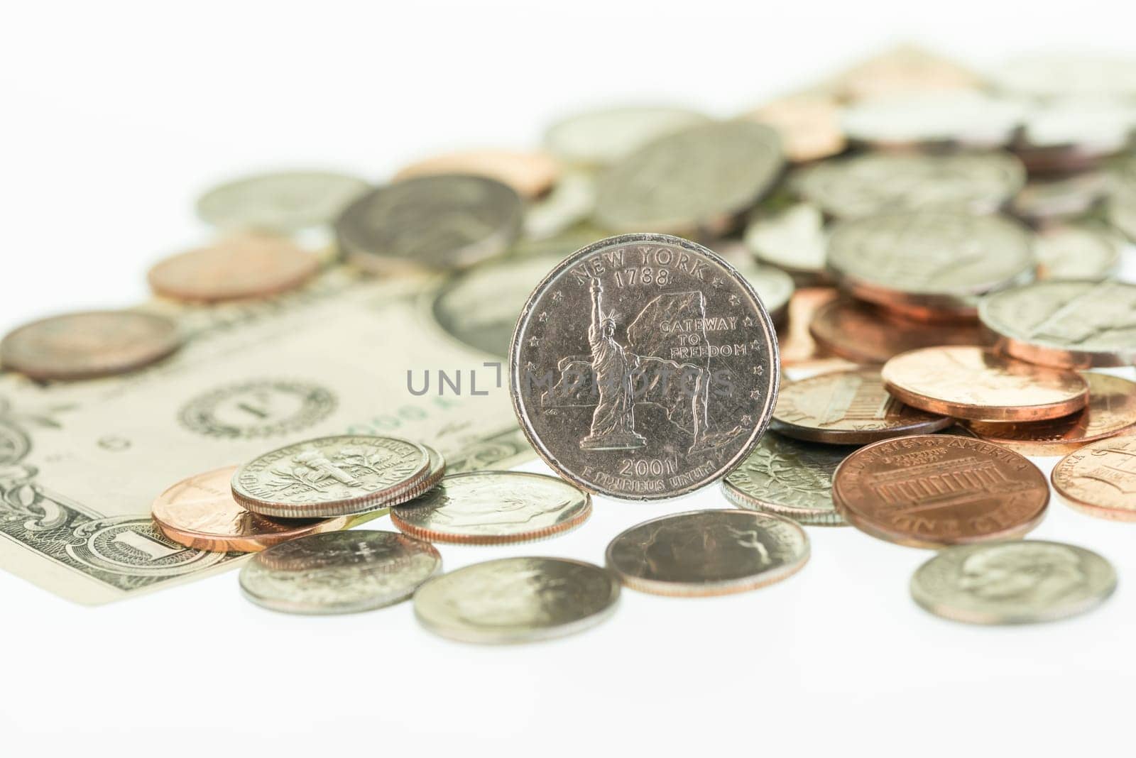 New York State Quarter with one dollar bill and coins close up