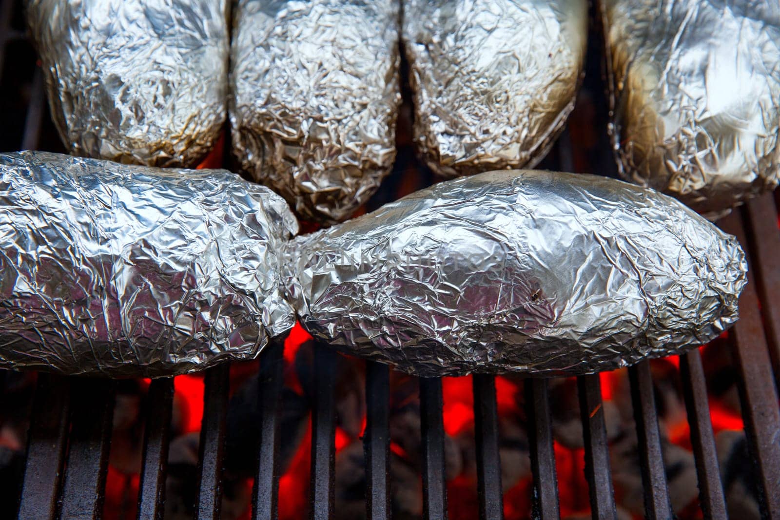 grilled whole potatoes with foil delicious meal and embers