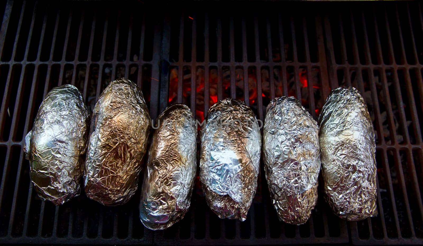 grilled whole potatoes with foil delicious meal and embers