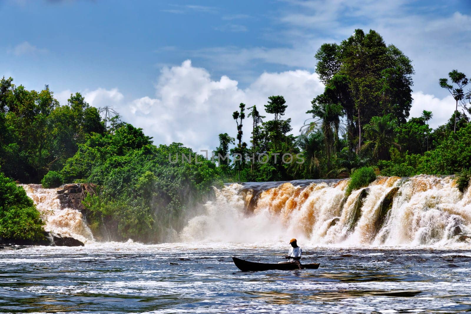 The old fisherman under the waterfall