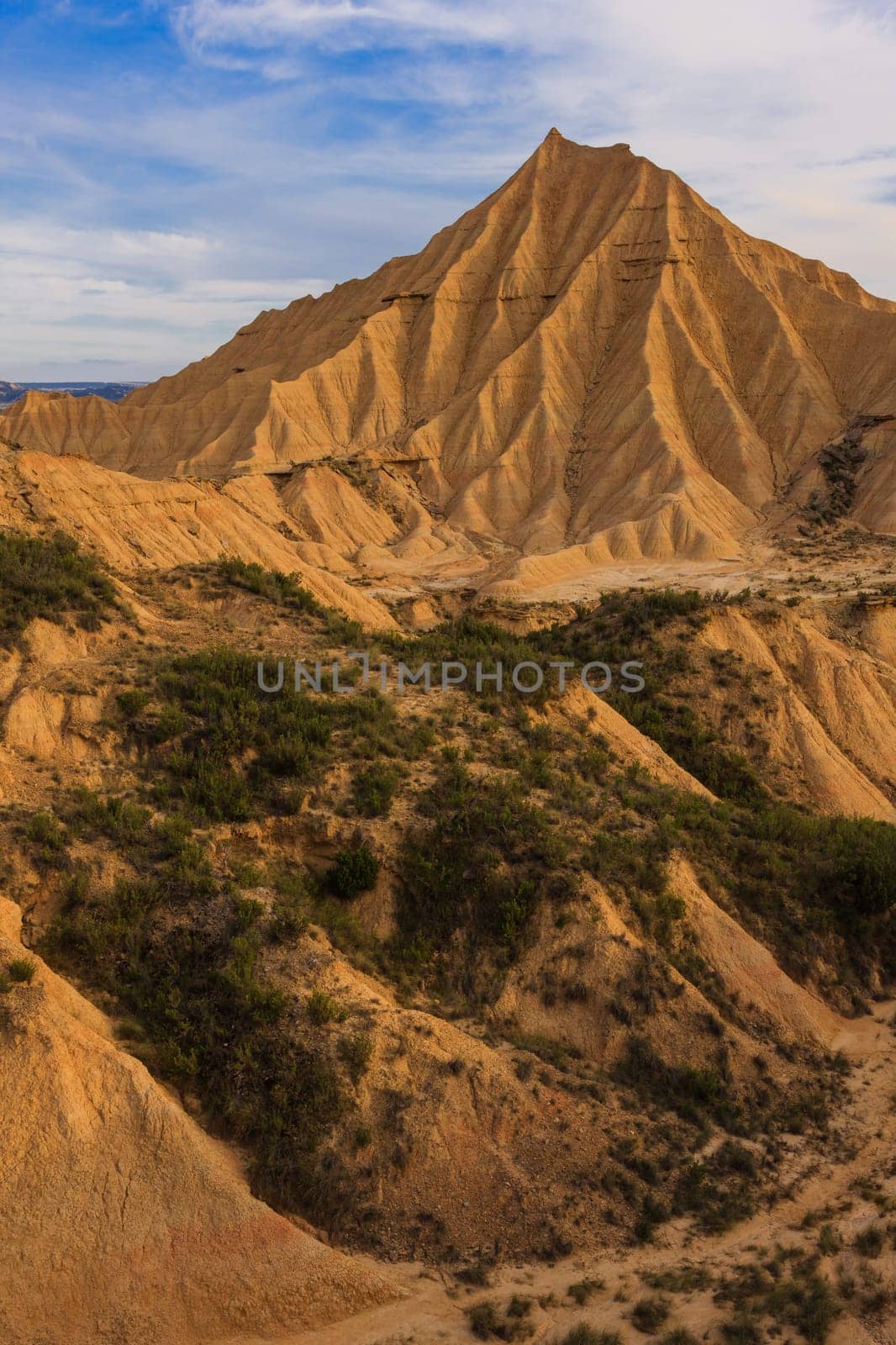 Desert landscape under the cloudy sky, Bardenas Reales, Navarra, Spain