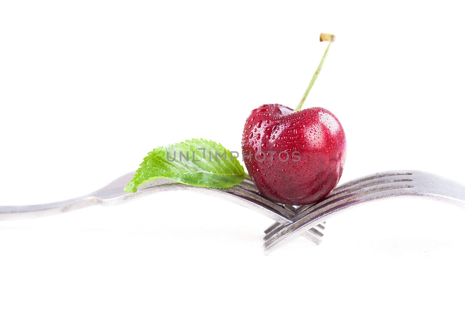 ripe cherry on a fork