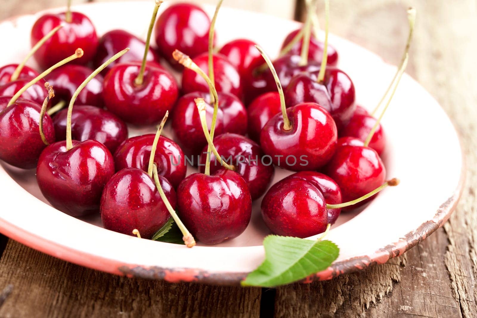 fresh cherries on a plate