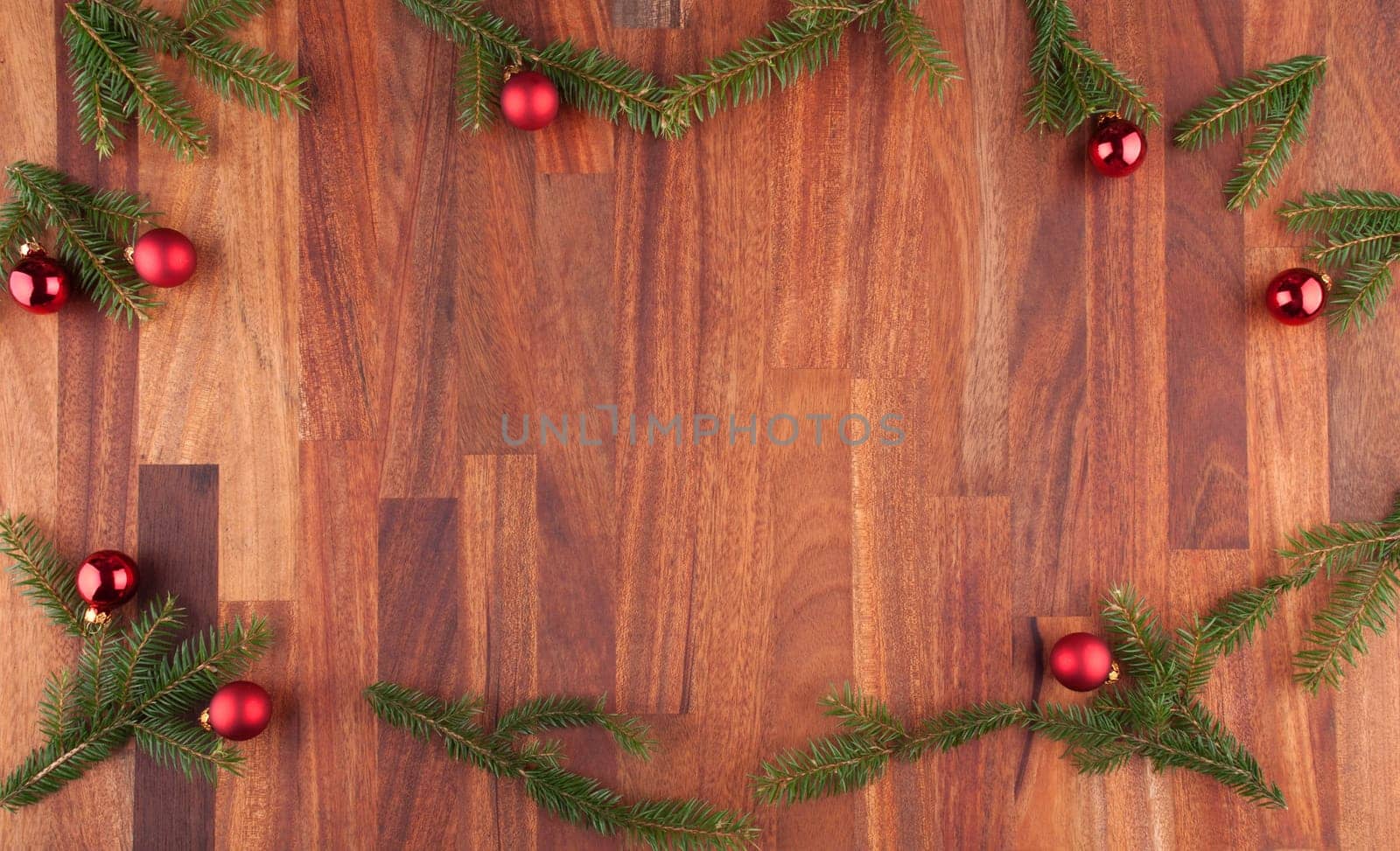 christmas decorations with fir, christmas balls and lumber with copy space in the middle