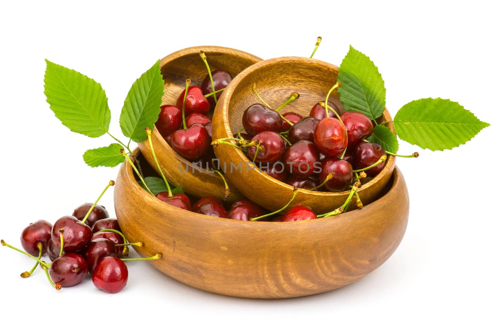 fresh cherries in a bowl on white background