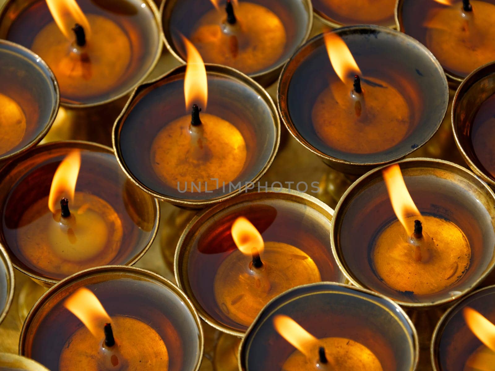 Butter lamps in a buddhist monastery in Kathmandu, Nepal
