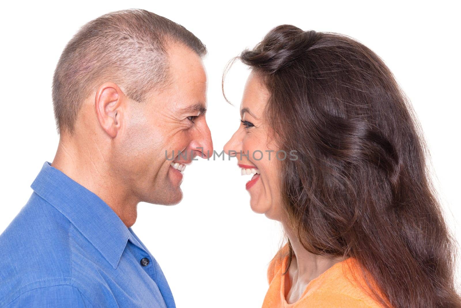 Happy middle-aged couple against a white background