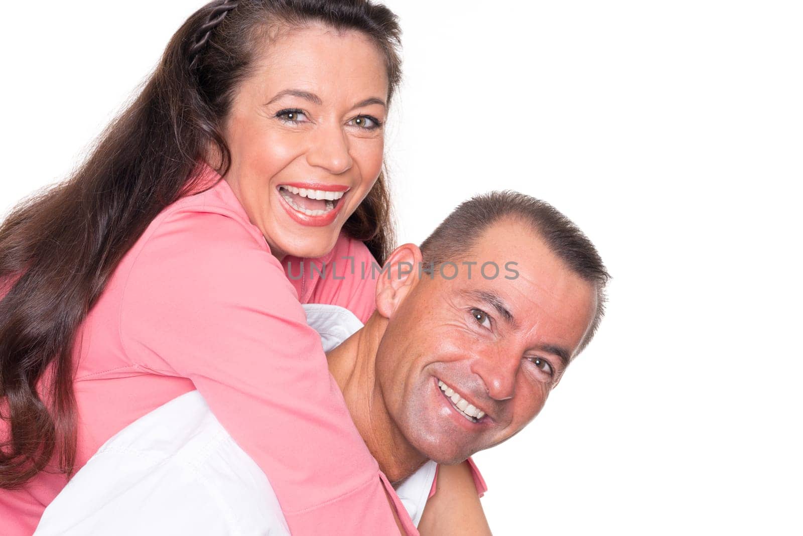 Happy middle-aged couple against a white background