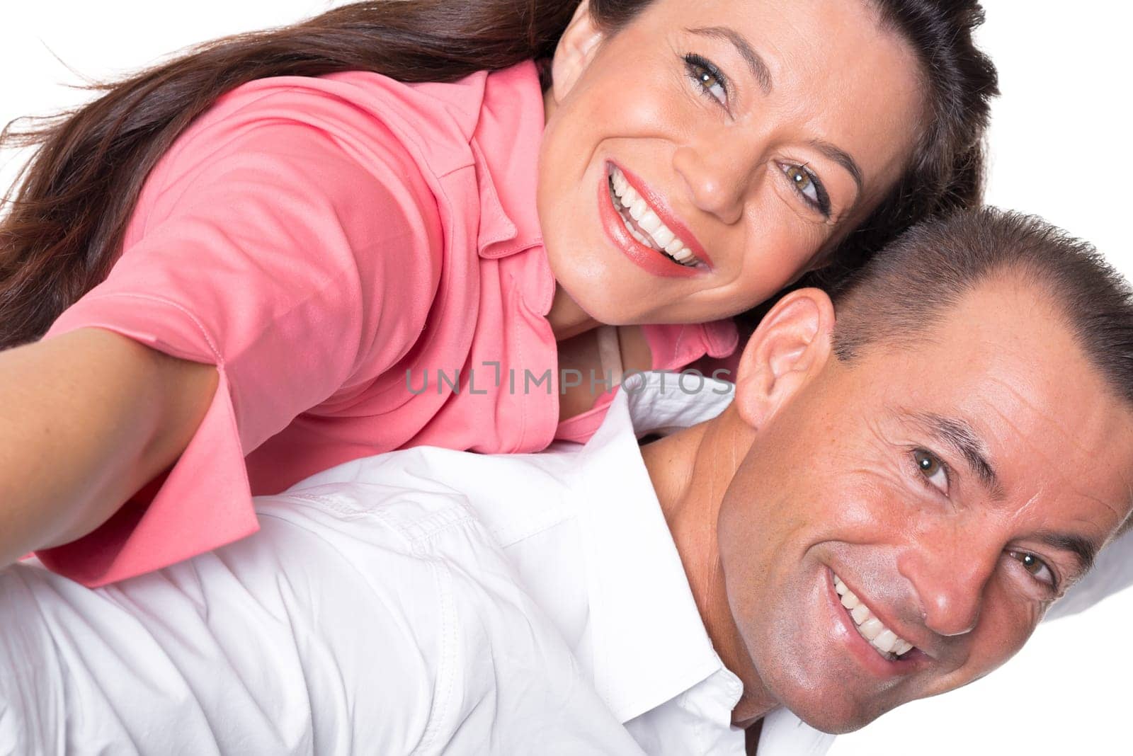 Happy middle-aged couple against a white background