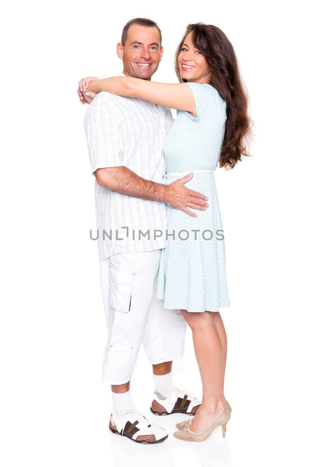 Happy middle-aged couple against a white background