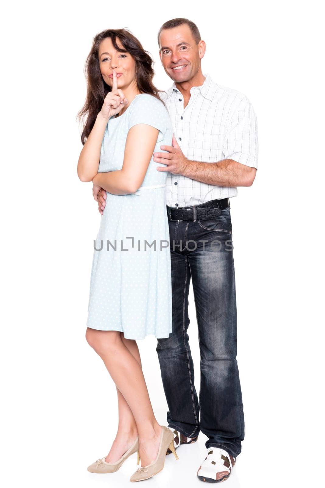 Happy middle-aged couple against a white background