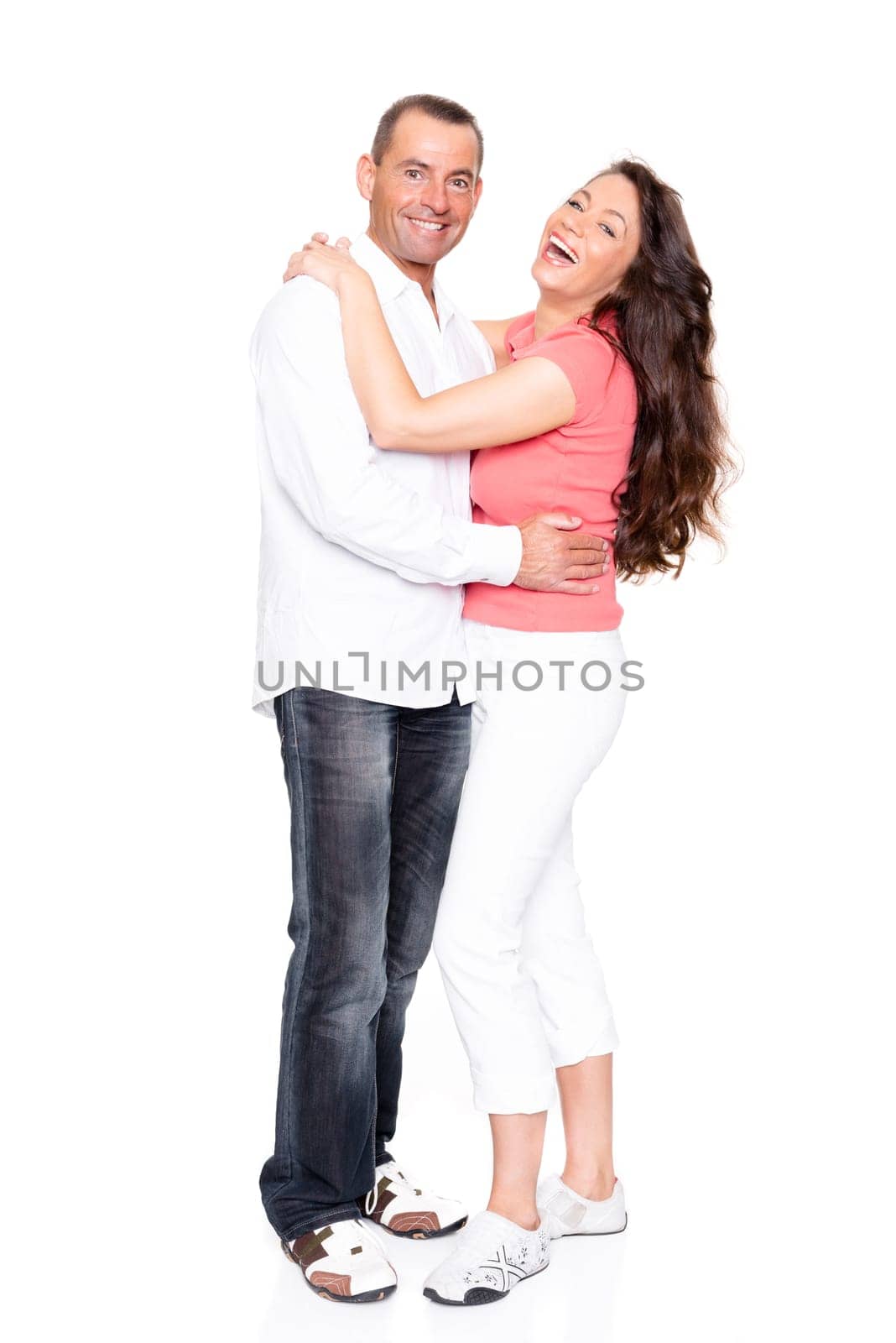 Happy middle-aged couple against a white background