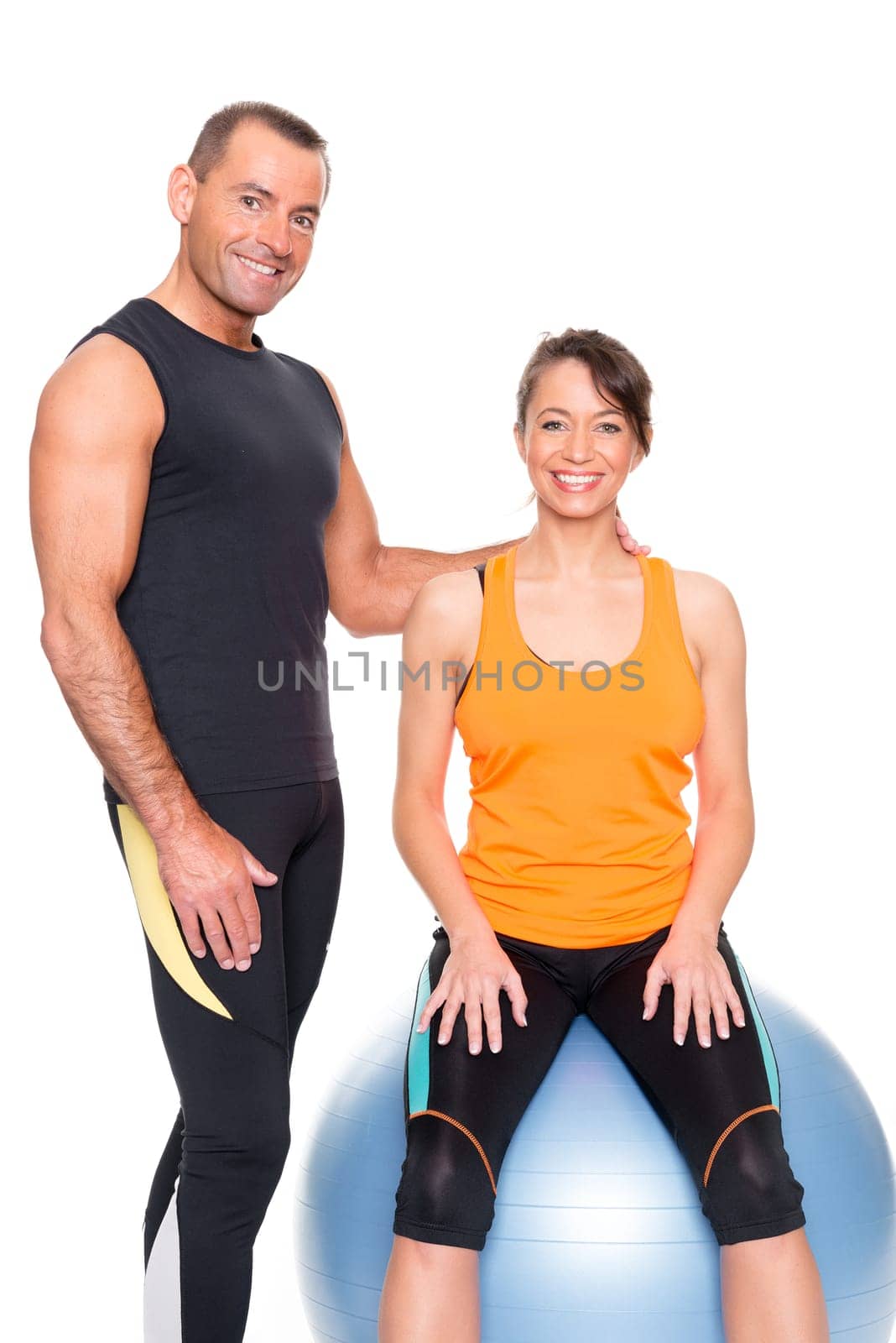 Sporty couple against a white background