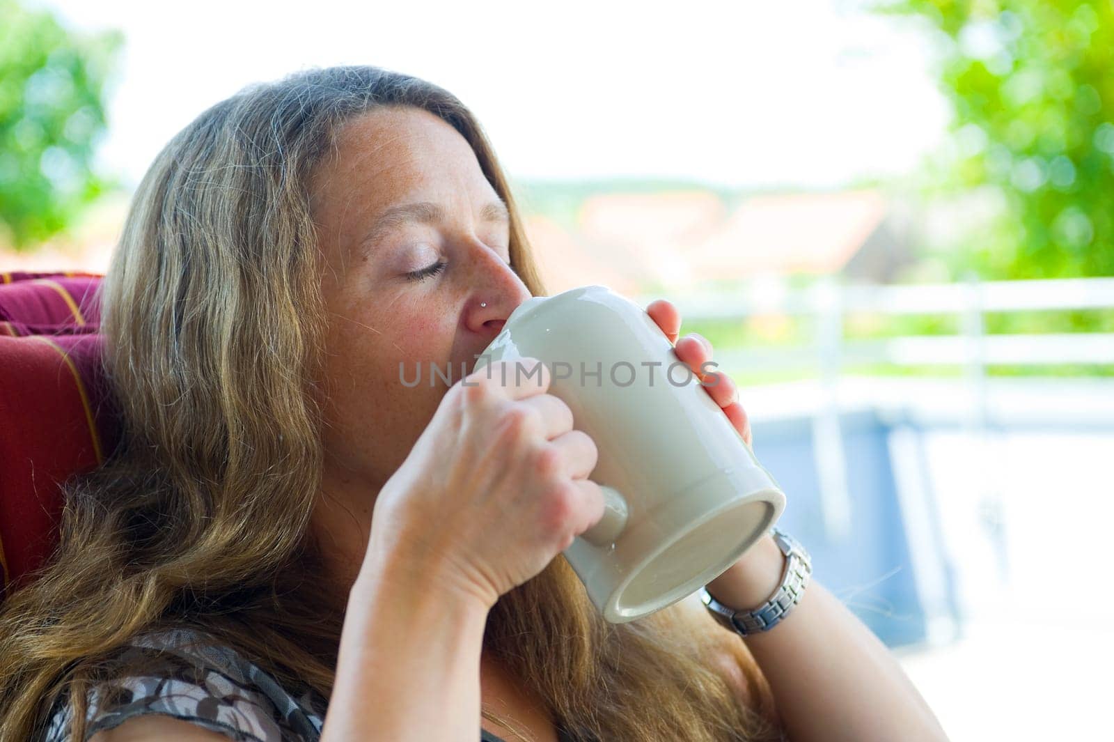 woman is drinking beer
