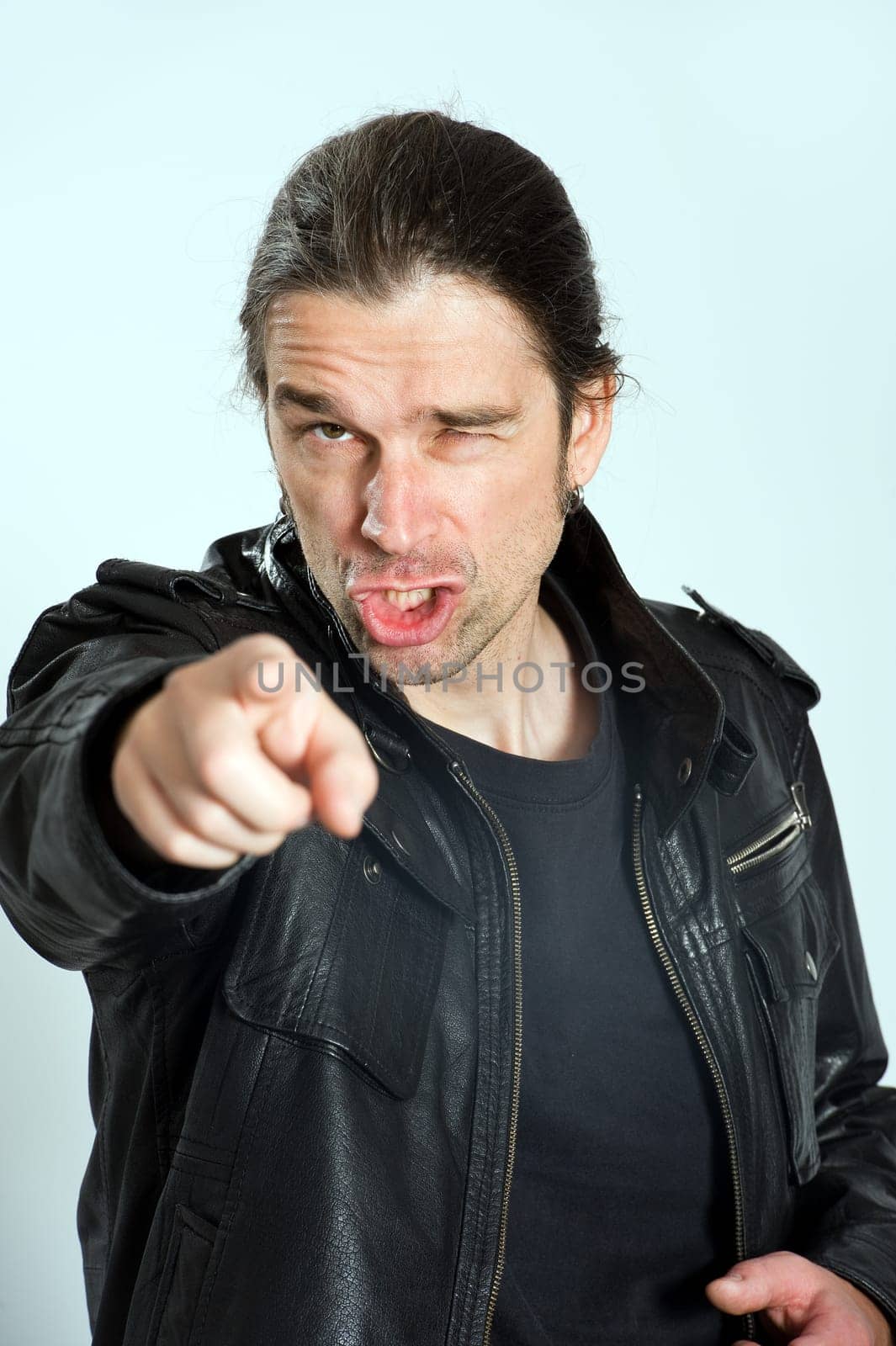 man is pointing in to the camera