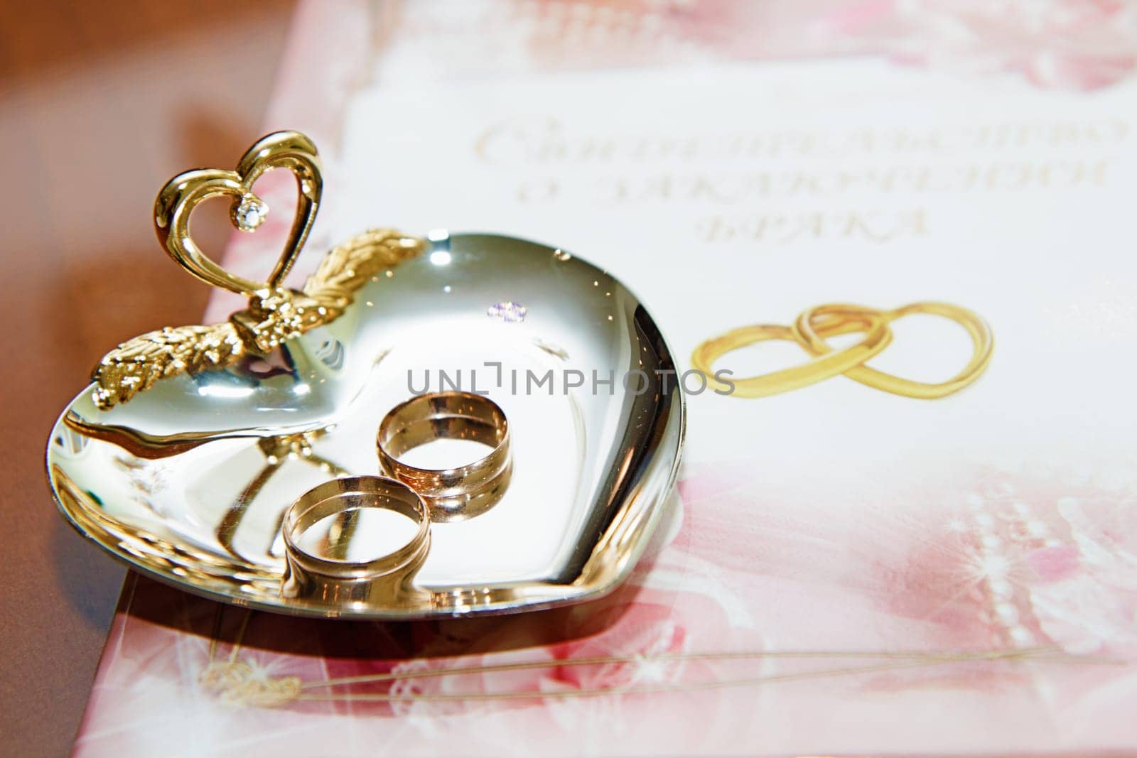 wedding rings and marriage certificate to the registration desk