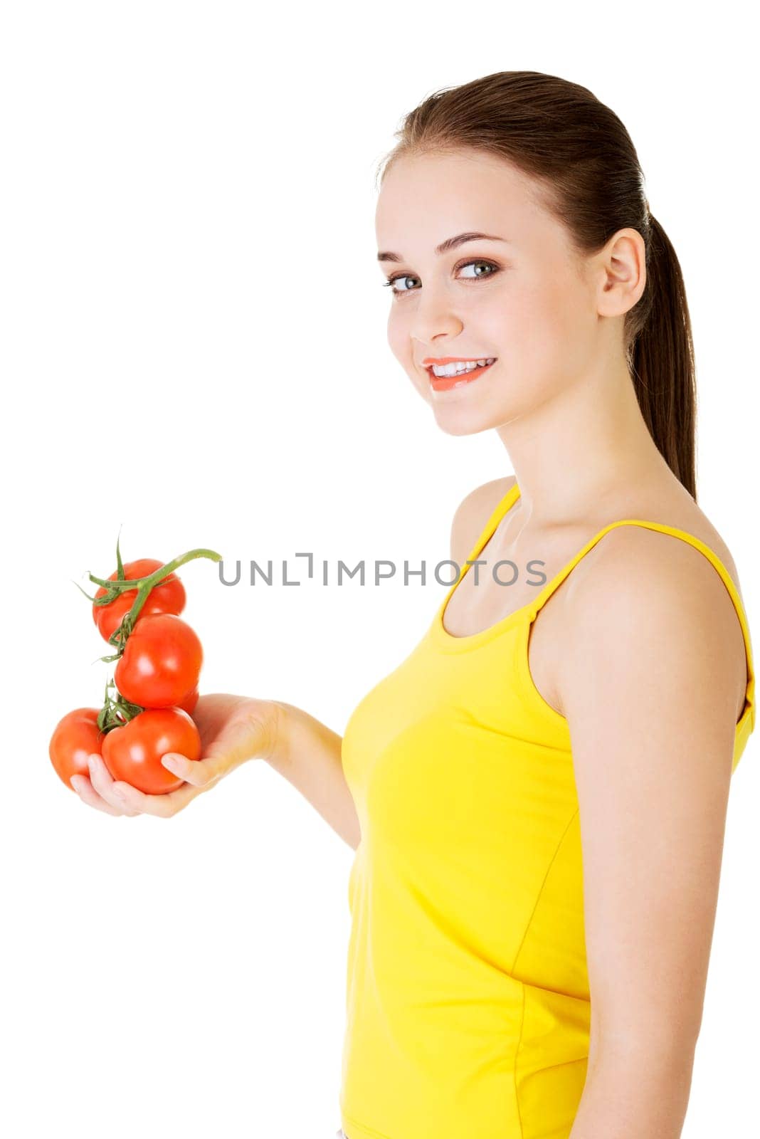 young happy woman with bunch of tomatoes. isolated on white.