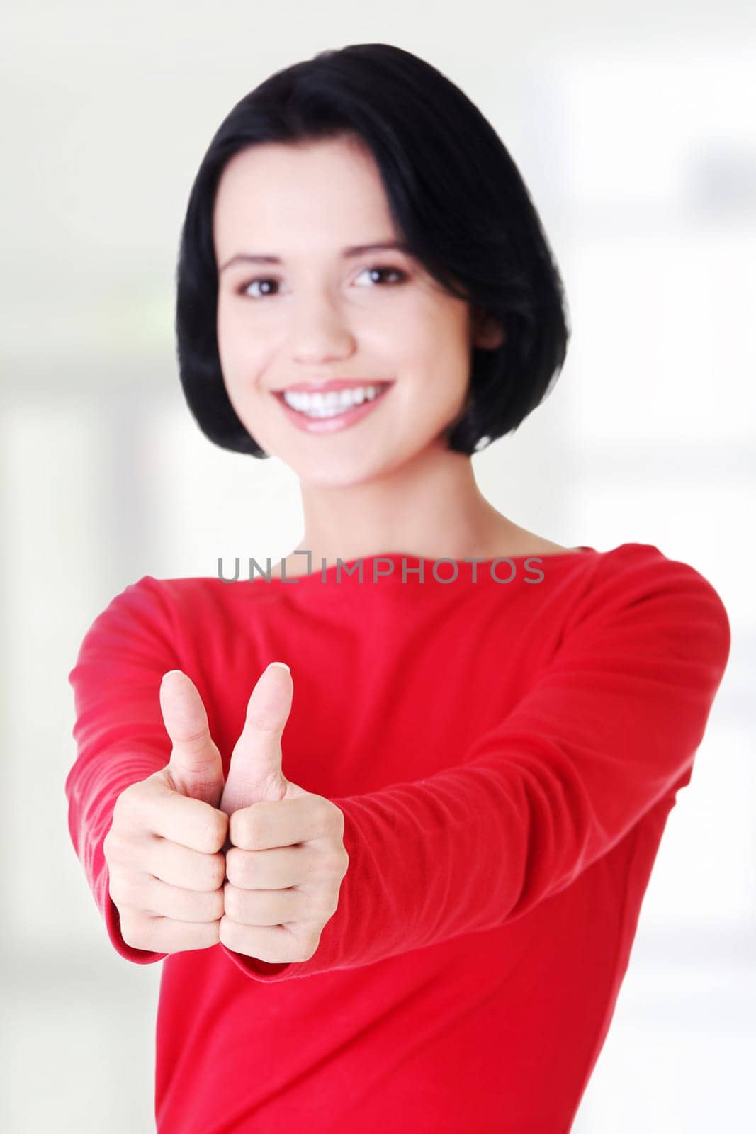 attractive young student woman gesturing ok