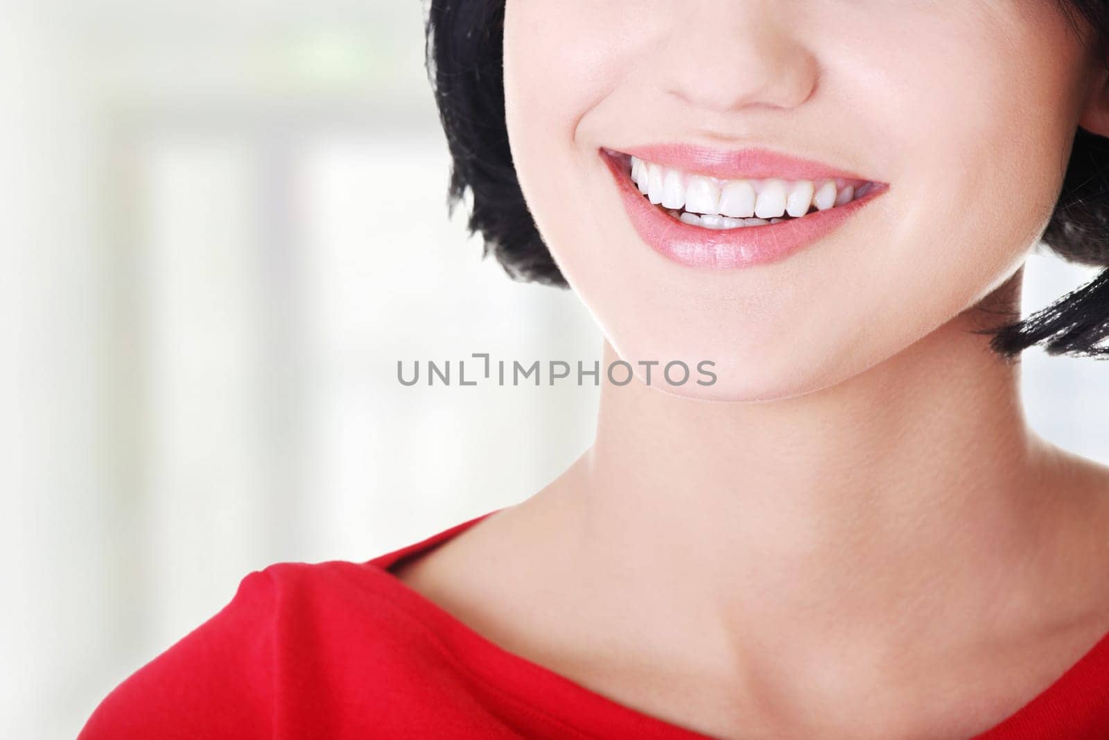 beautiful woman with her perfect straight white teeth.