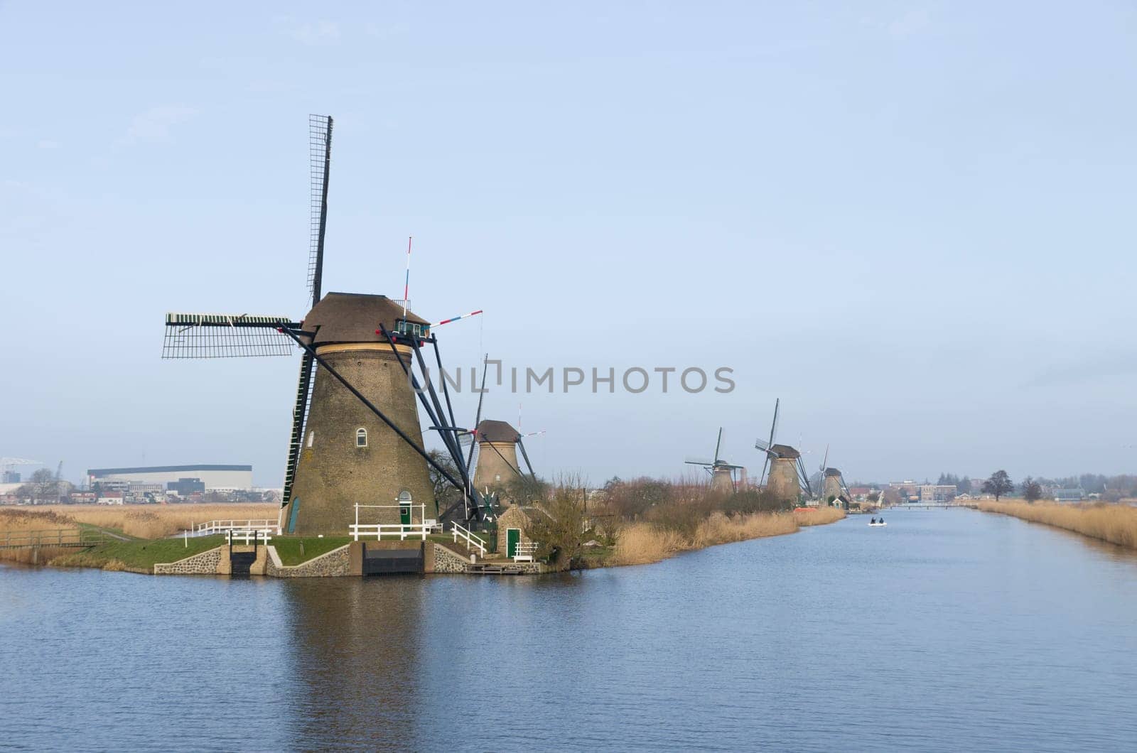 typical dutch windmills at Kinderdijk, Netherlands. A system of 19 windmills was built around 1740 to drain the polder. This group of mills is the largest concentration of old windmills in the Netherlands. The windmills of Kinderdijk are one of the best known Dutch tourist sites. They have been a UNESCO World Heritage Site since 1997.