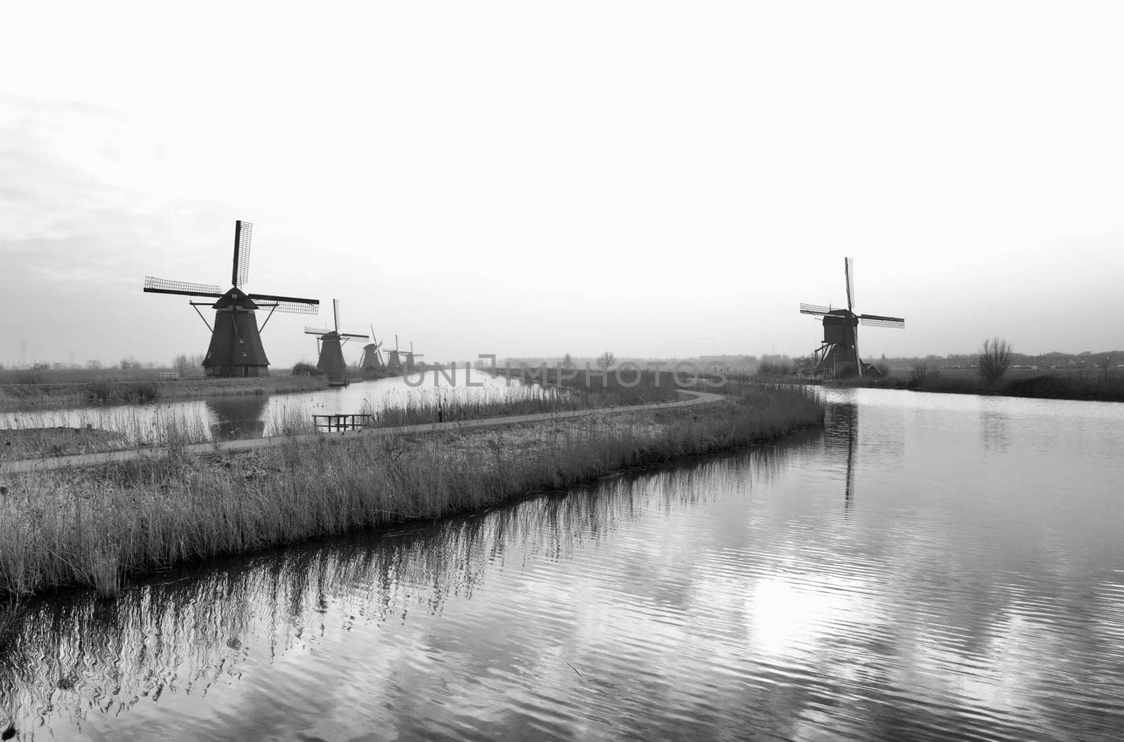 typical dutch windmills at Kinderdijk, Netherlands. A system of 19 windmills was built around 1740 to drain the polder. This group of mills is the largest concentration of old windmills in the Netherlands. The windmills of Kinderdijk are one of the best known Dutch tourist sites. They have been a UNESCO World Heritage Site since 1997.