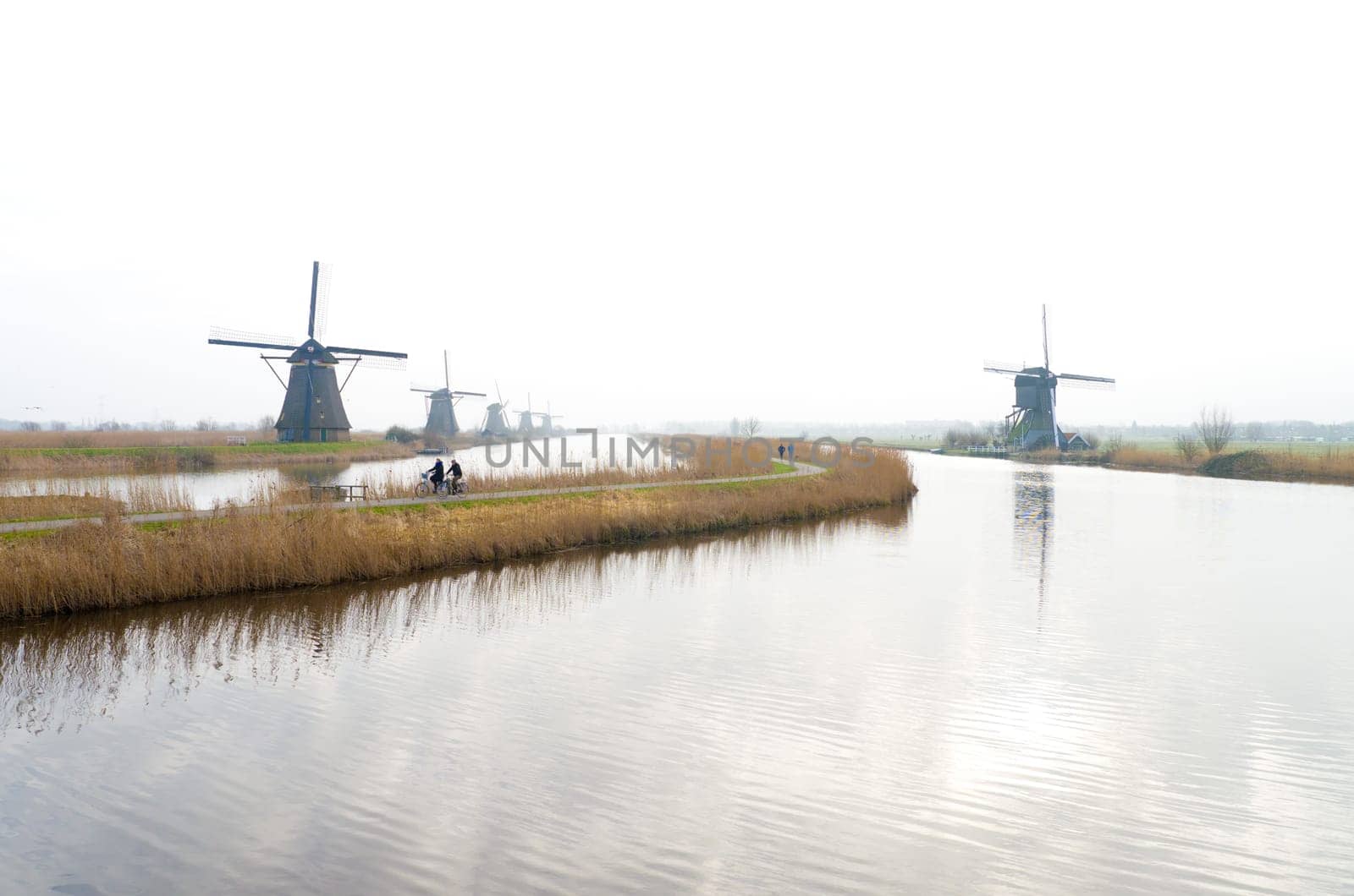 typical dutch windmills at Kinderdijk, Netherlands. A system of 19 windmills was built around 1740 to drain the polder. This group of mills is the largest concentration of old windmills in the Netherlands. The windmills of Kinderdijk are one of the best known Dutch tourist sites. They have been a UNESCO World Heritage Site since 1997.
