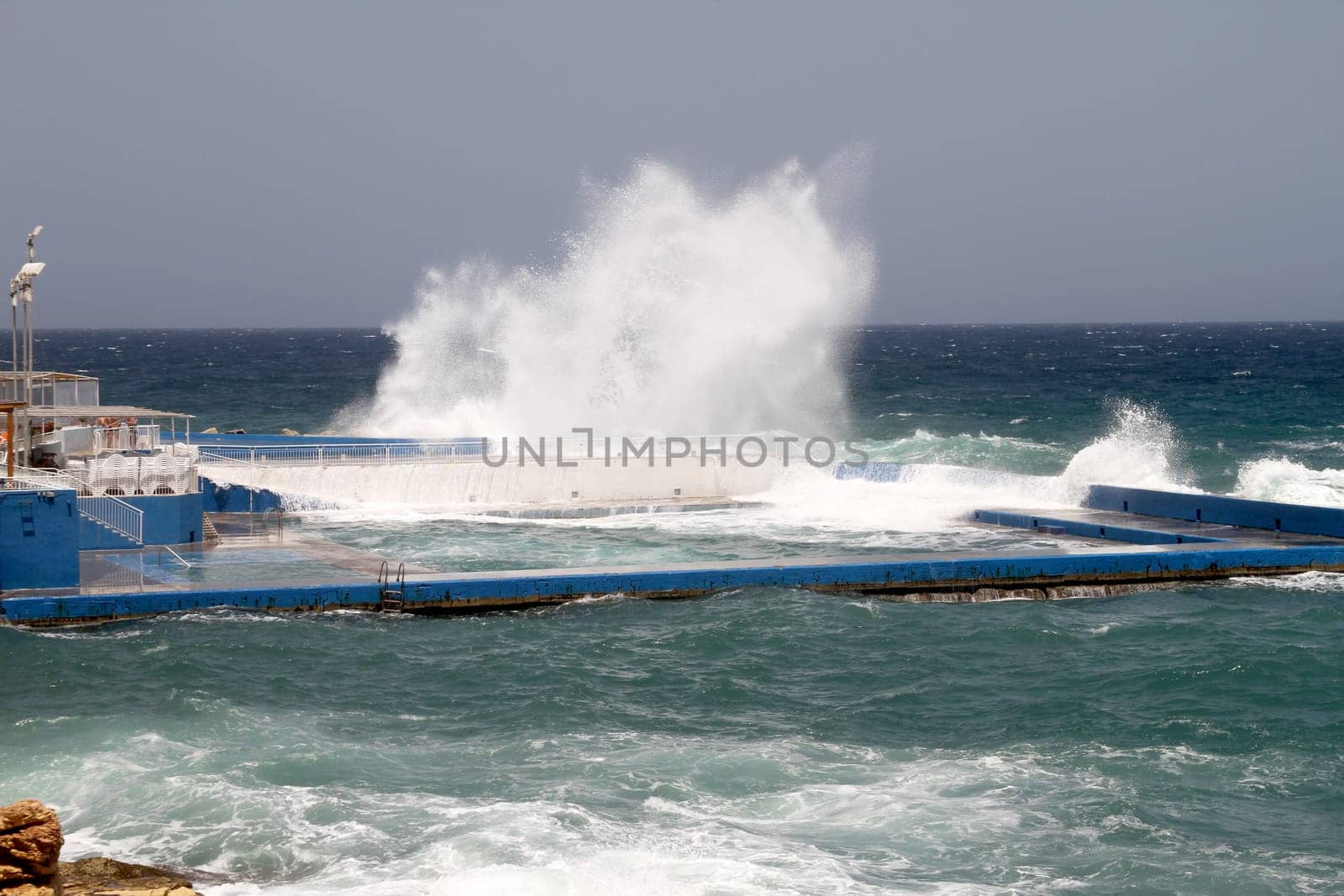 Huge waves getting into the swimming pool