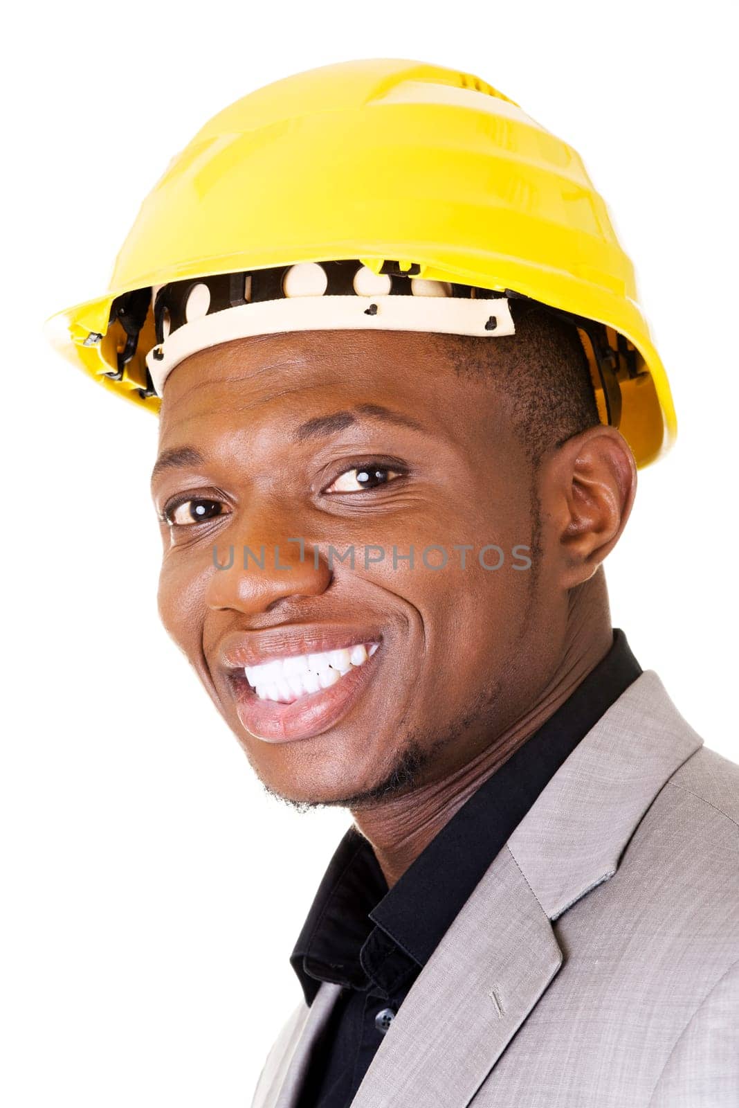 Happy successful businesman in helmet. Isolated on white.