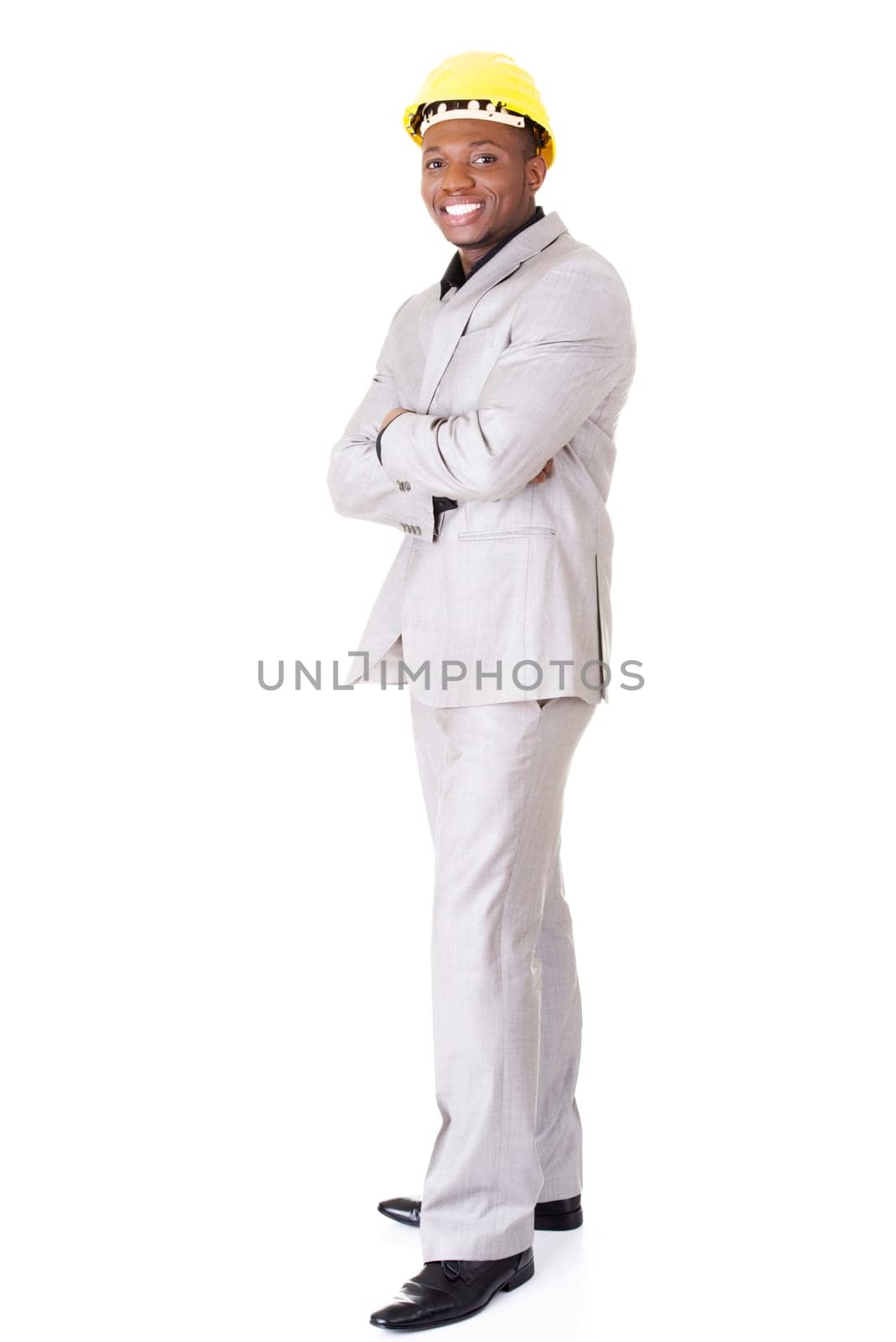Happy successful businesman in helmet. Isolated on white.