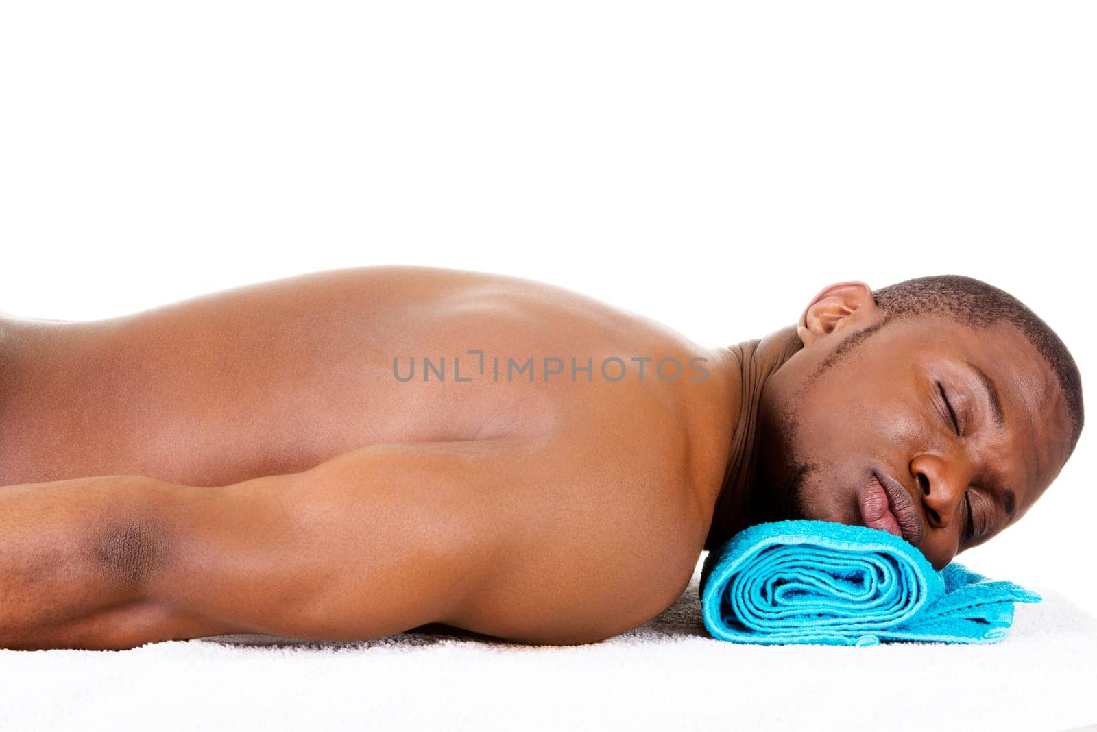 Man receiving massage at spa saloon