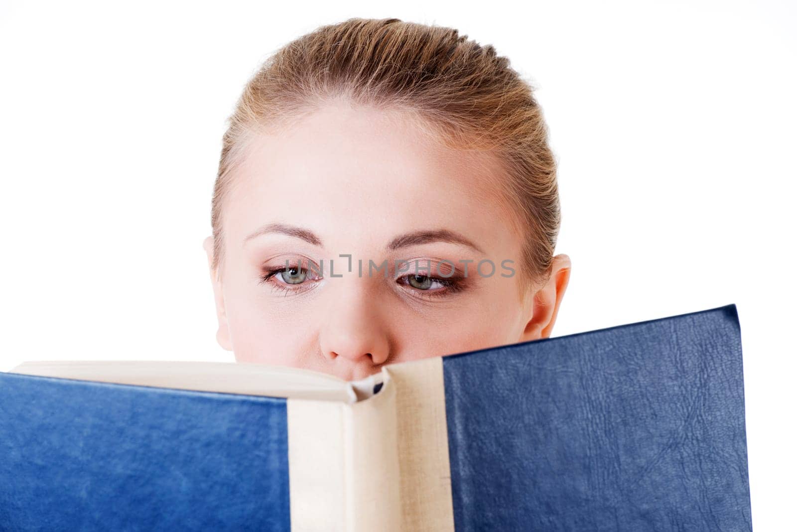 Girl reading a book, isolated on white background