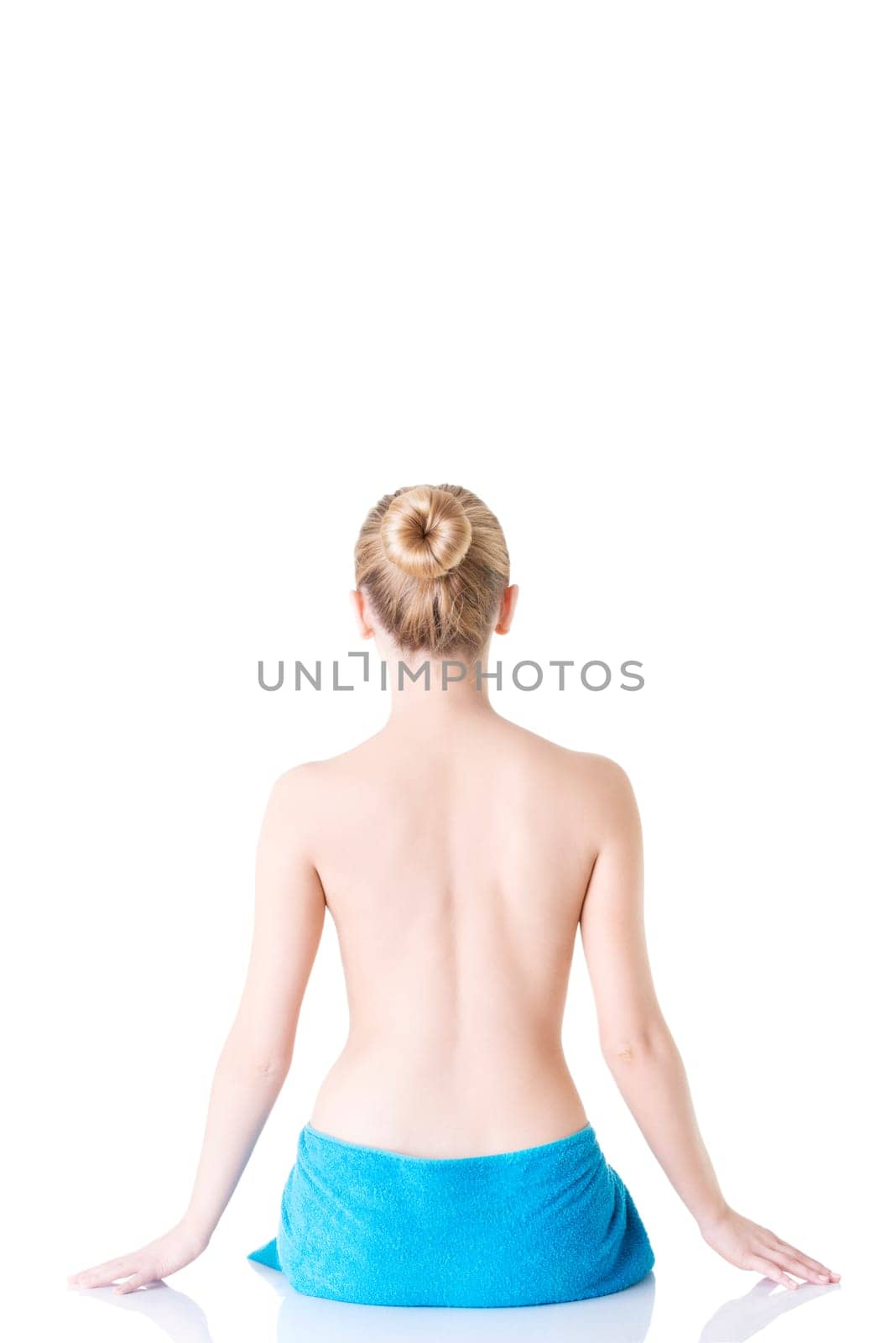 Young beautiful nude woman with towel , isolated on white
