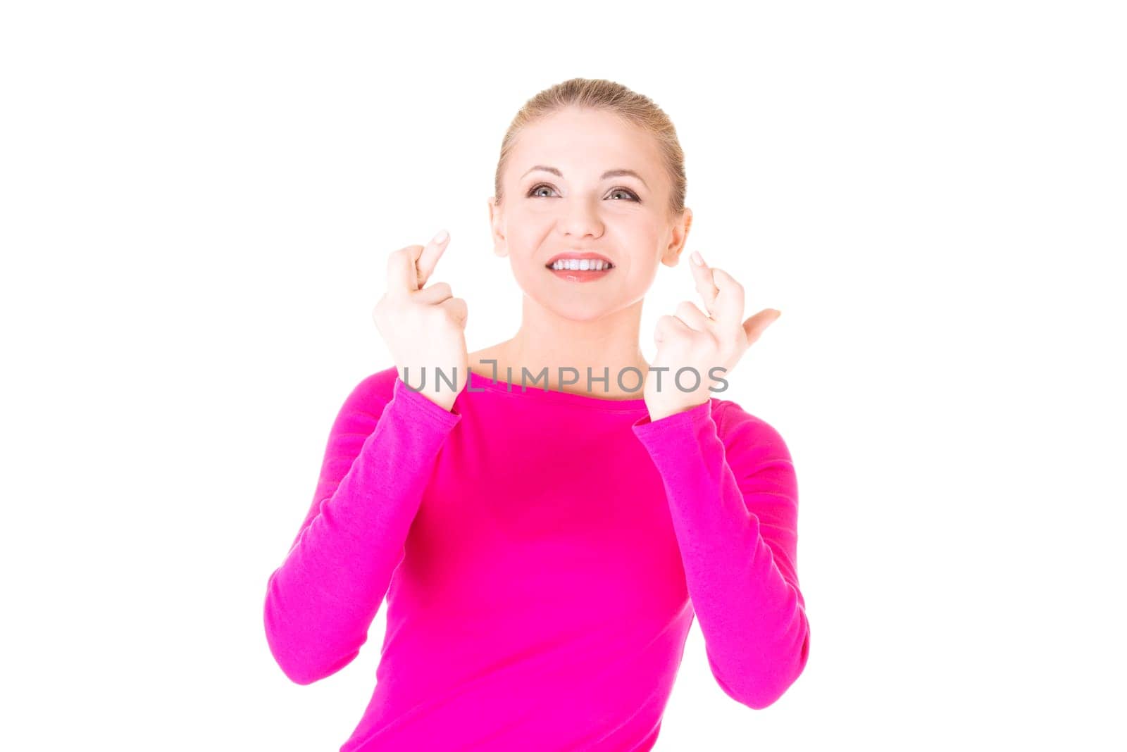 Woman with fingers crossed, isolated on white.