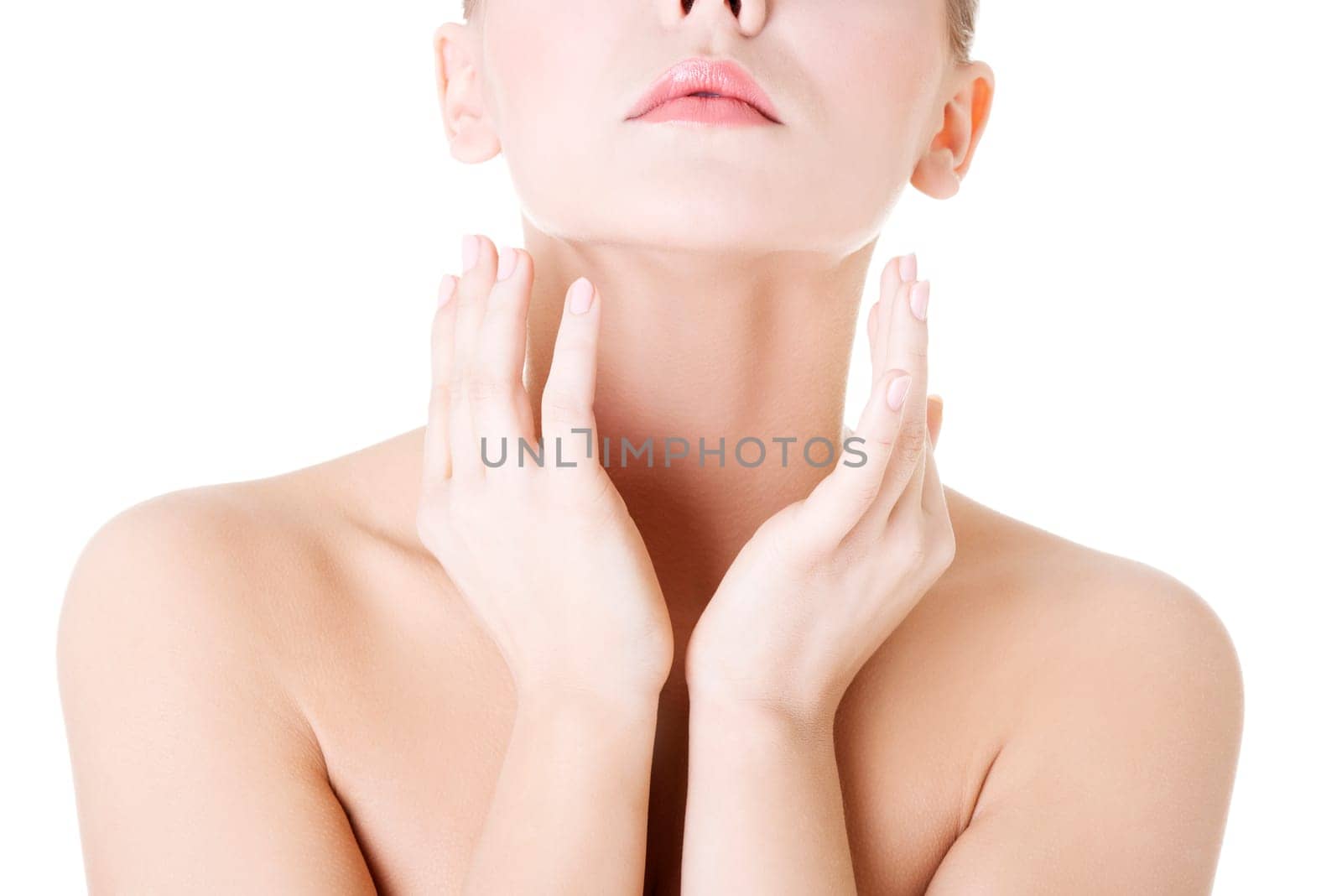 Beautiful sensual young woman touching her neck, isolated on white