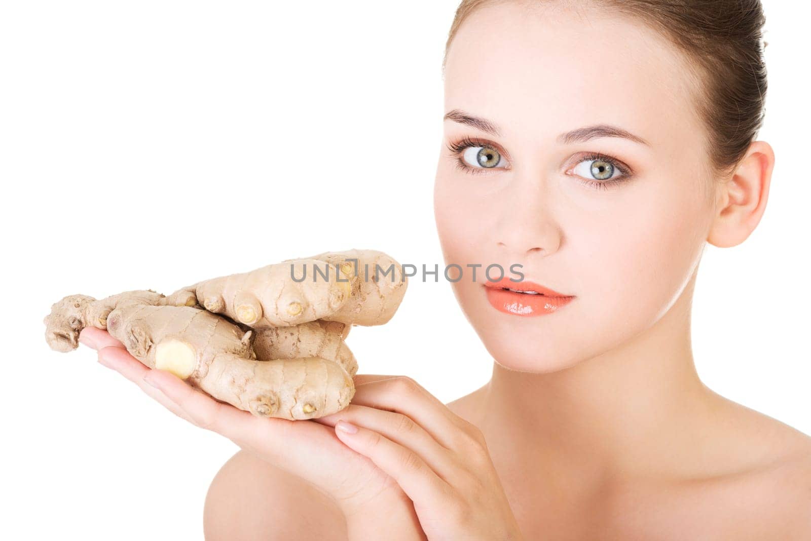Beautiful woman with fresh ginger, isolated on white