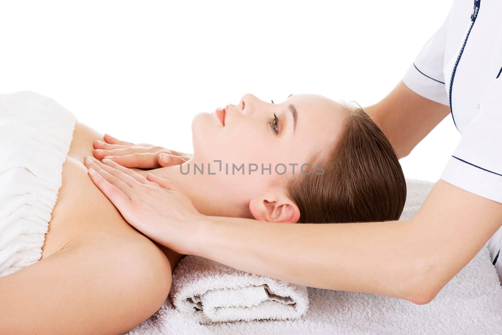 Preaty young woman relaxing beeing massaged in spa saloon