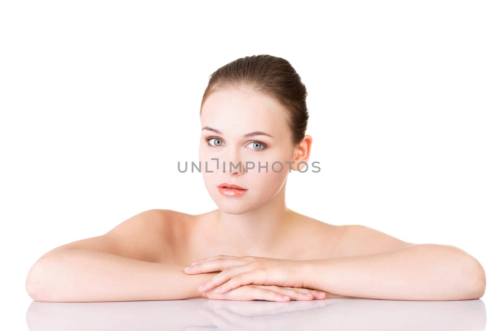Beautiful face of spa woman with healthy clean skin. Isolated on white.
