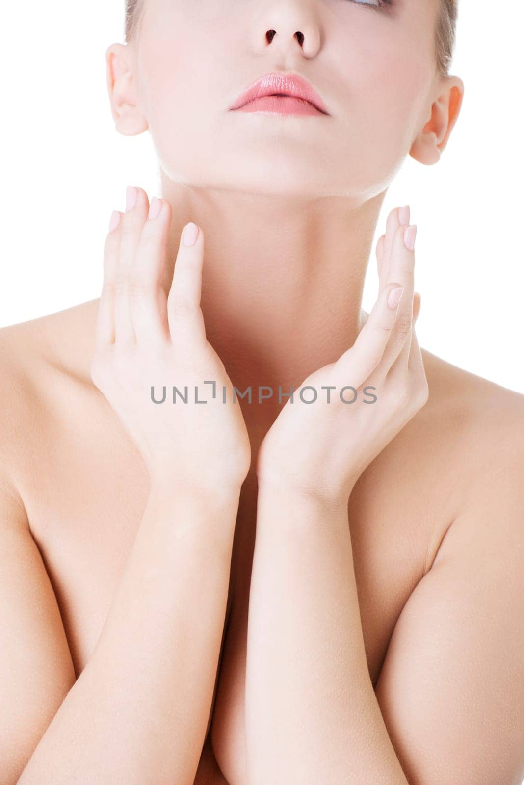 Beautiful sensual young woman touching her neck, isolated on white