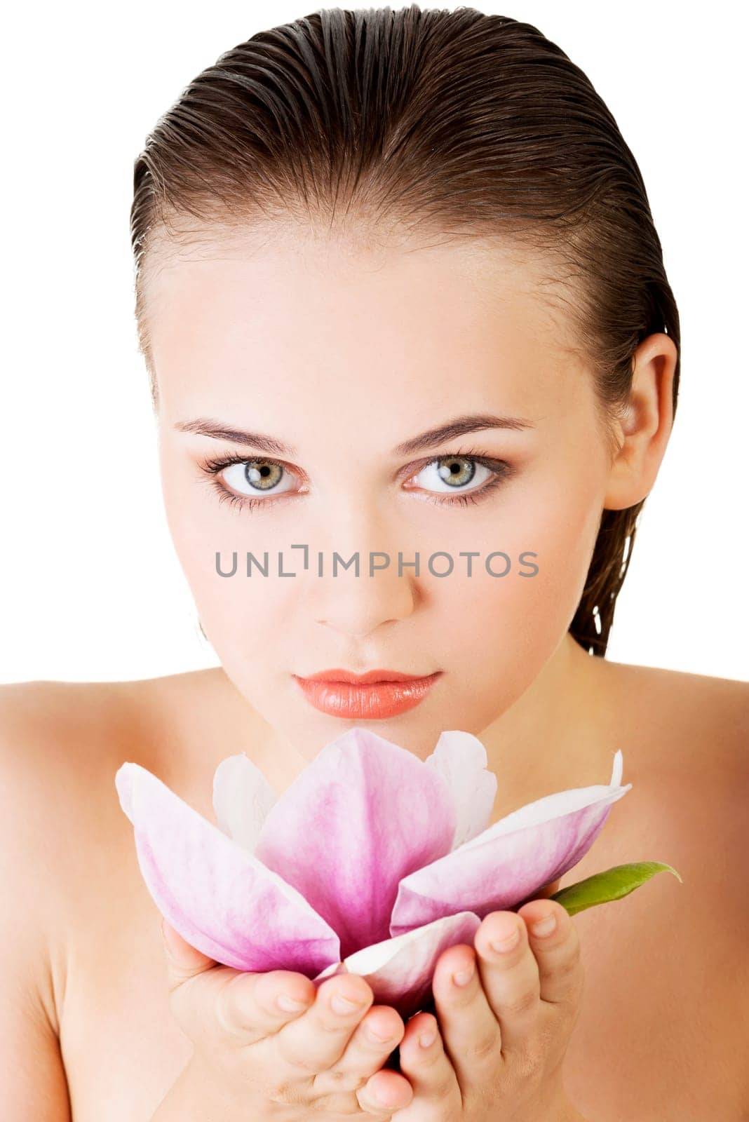 Beautiful face of spa woman with healthy clean skin and pink flowers. Isolated on white.