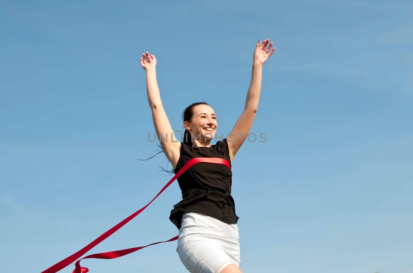 Woman crosses the finish line and wins
