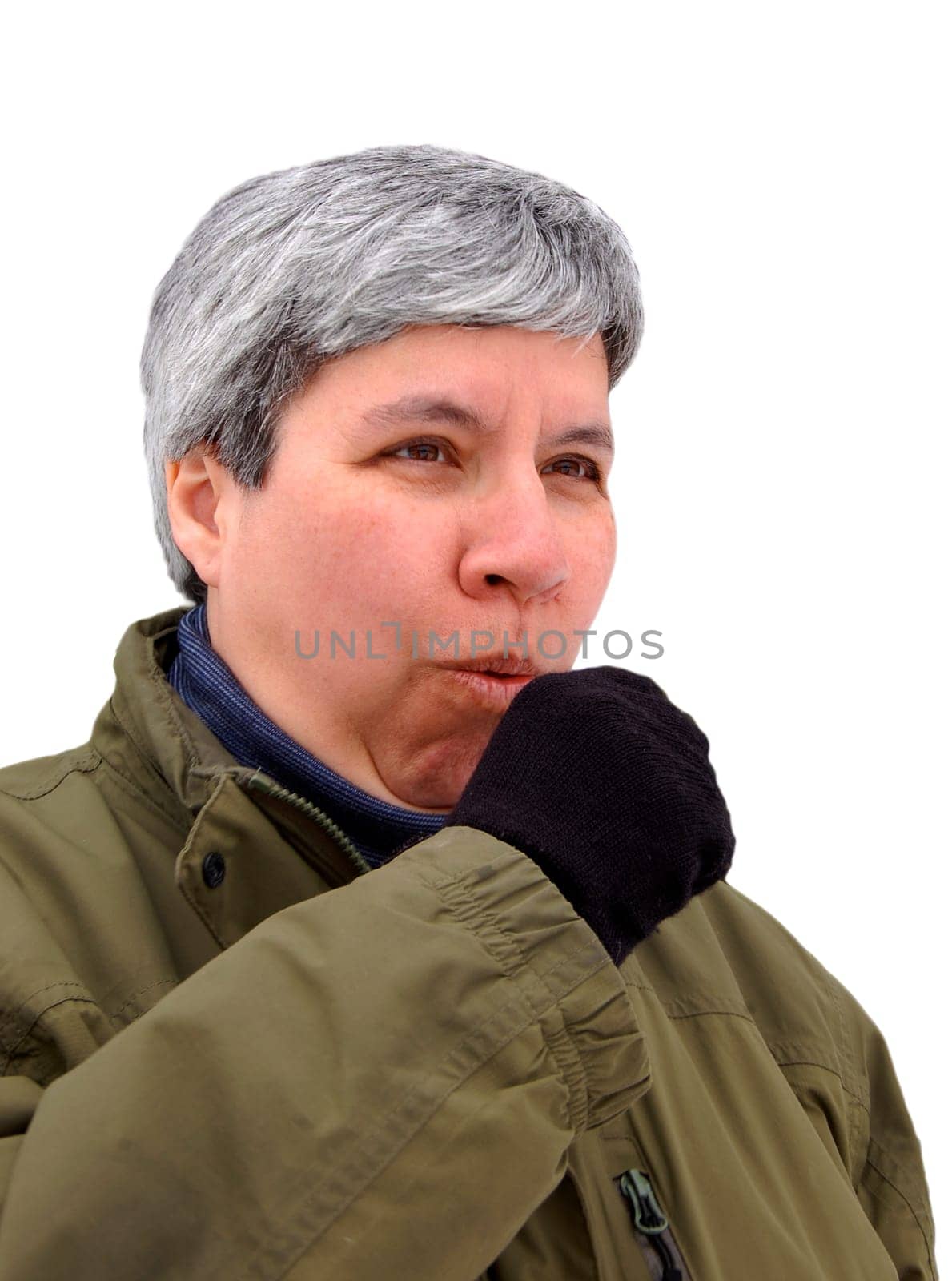 middle aged woman in winter, coughing into gloved hand