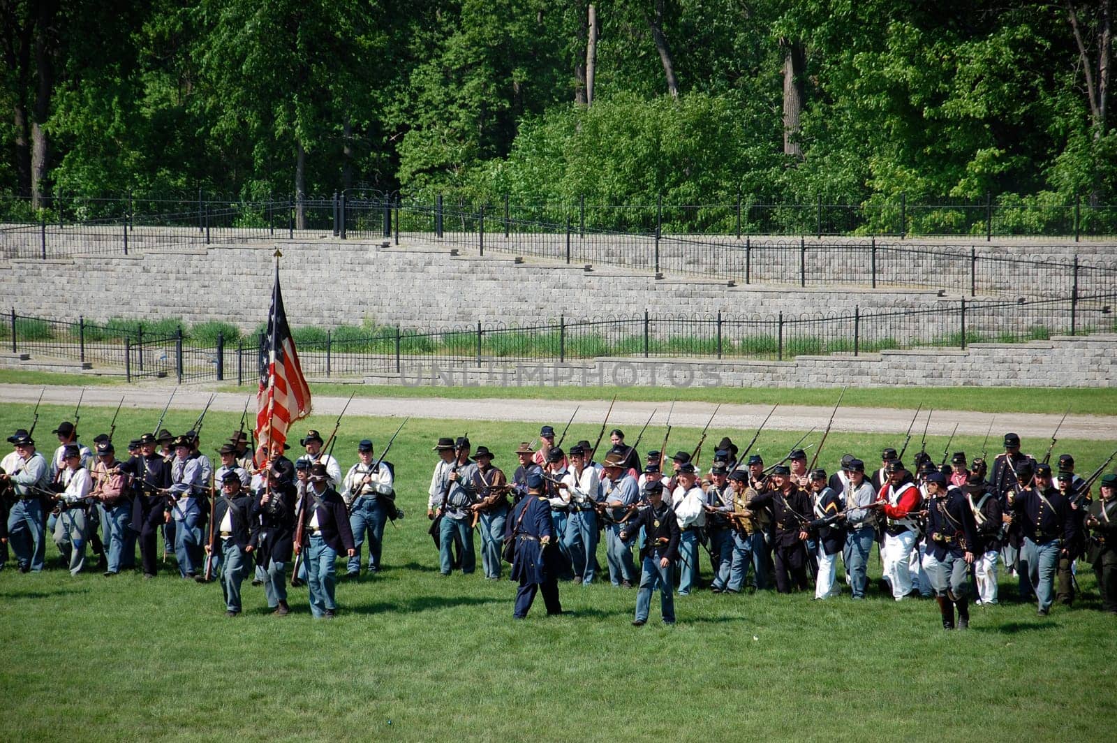 DEARBORN, MI - MAY 30: A line of soldiers advances during an American Civil War battle reenactment May 30, 2011 at Greenfield Villa, Dearborn, MI