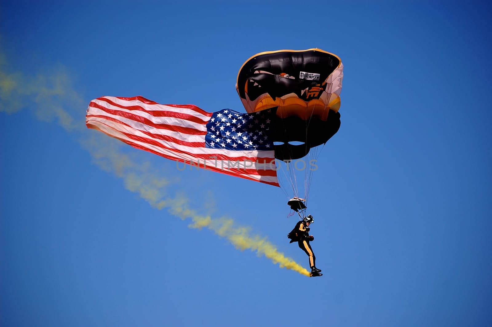 ANN ARBOR, MI - OCTOBER 09: 101st Airborne Division Parachute Demonstration Team member parachutes into Michigan Stadium before the Michigan vs. Michigan State football game October 9, 2010.