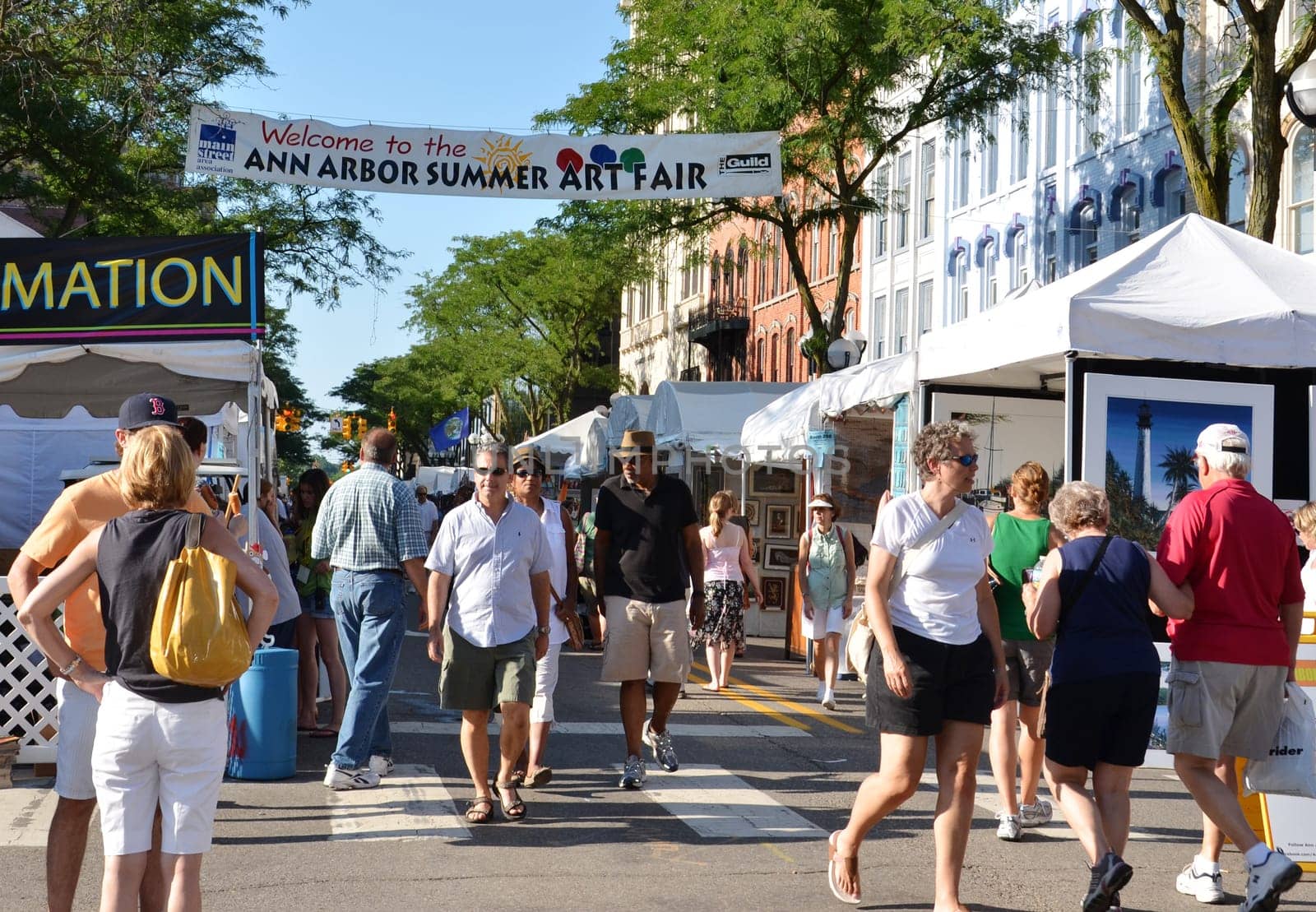 ANN ARBOR, MI - JULY 20: Crowds enjoy the Ann Arbor Summer Art Fair in Ann Arbor, MI. Organized by The Guild of Artists and Artisans, it is one of four art fairs in Ann Arbor July 20-23, 2011.