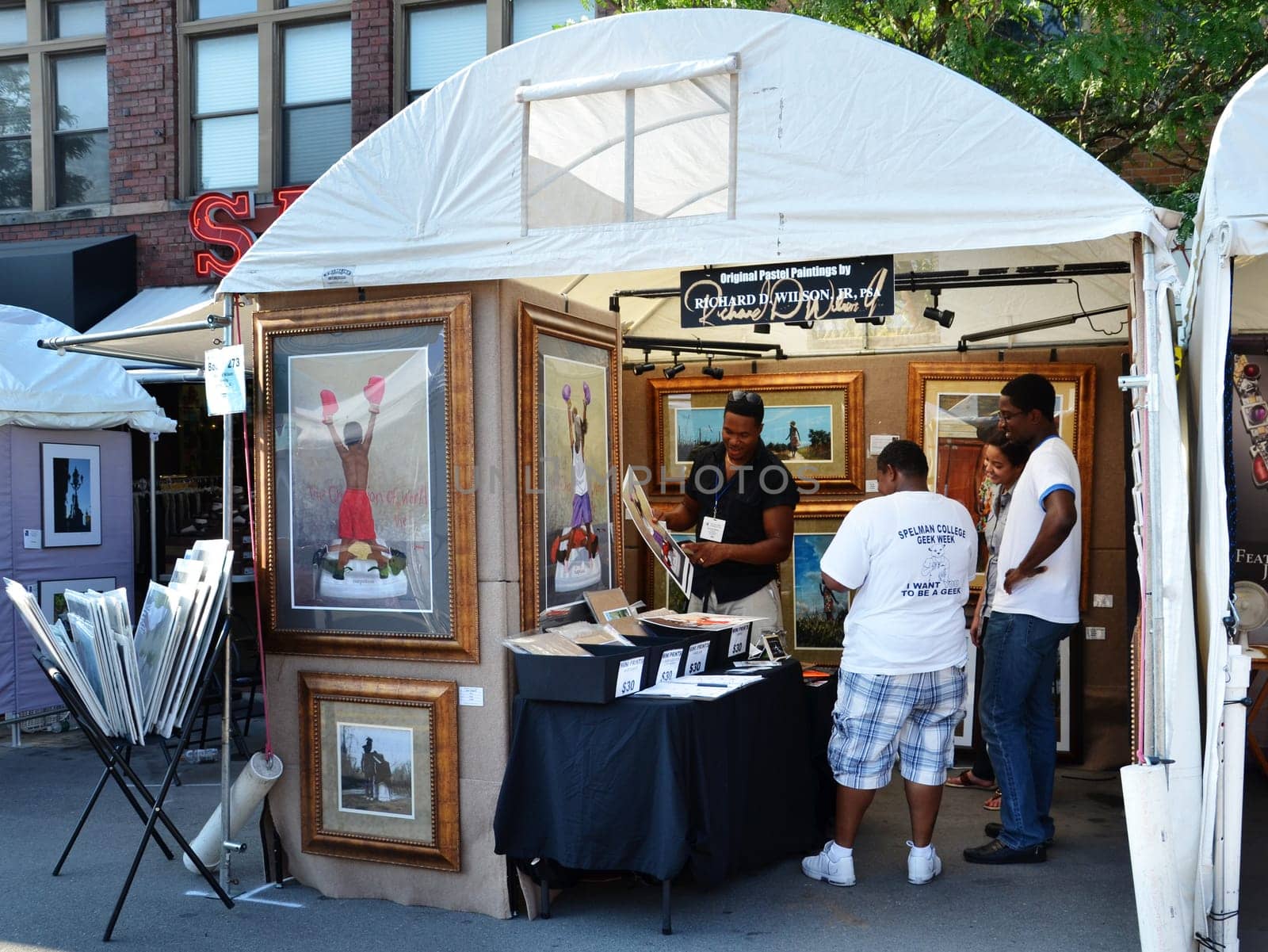 ANN ARBOR, MI - JULY 20: Pastelist Richard Wilson discussed his work with admirers at the Ann Arbor Summer Art Fair in Ann Arbor, MI, July 20-23, 2011. Wilson earned the first place award in 2010.
