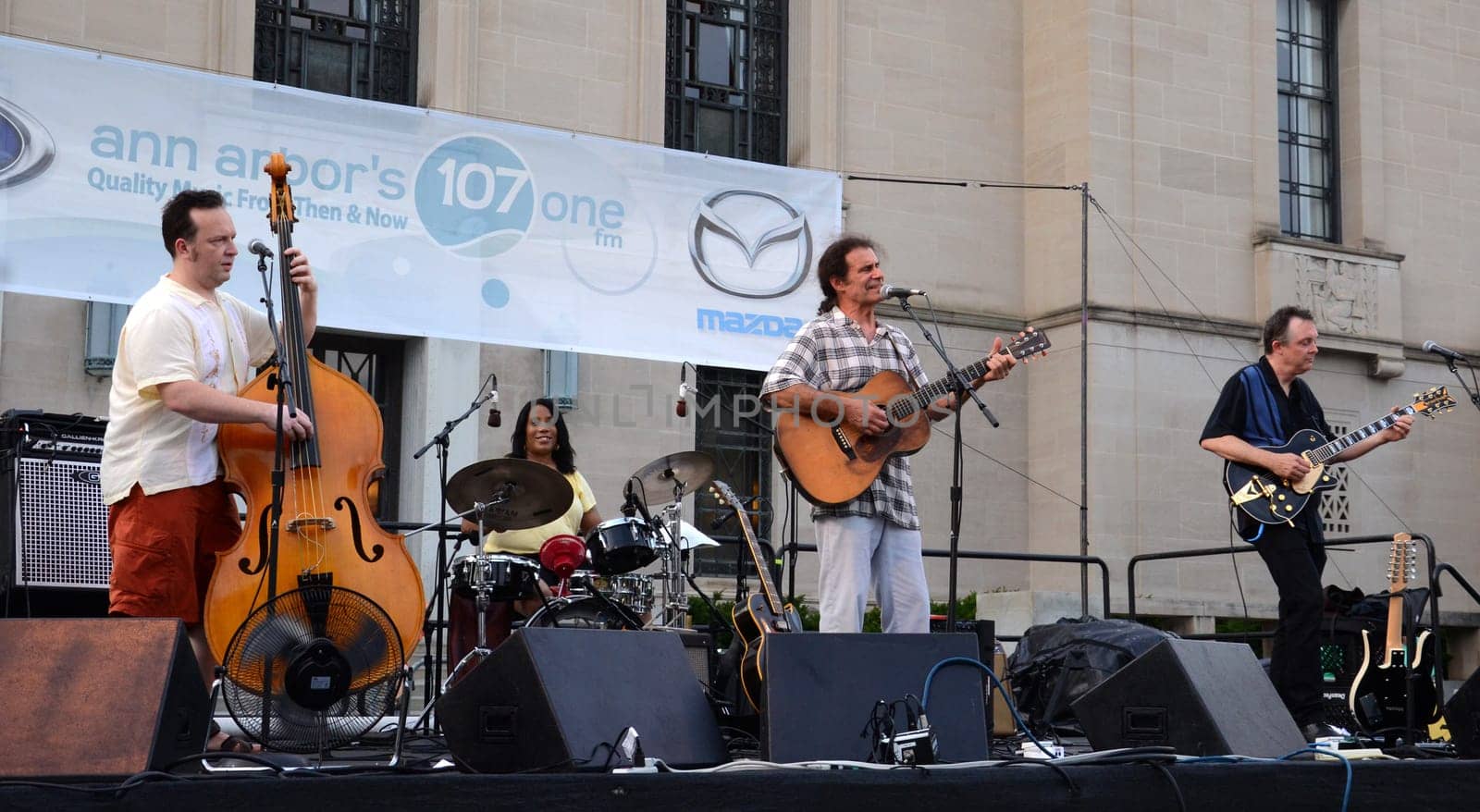 ANN ARBOR, MI – JULY 3: Dick Siegel, Dave Roof and Brian Delaney of Dick Siegel & the Brandos perform with drummer Gayelynn McKinney at the Ann Arbor Summer Festival July 3, 2012 in Ann Arbor, MI.