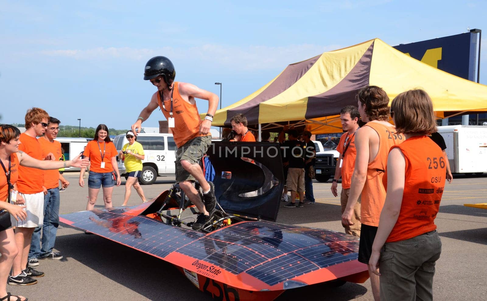 ANN ARBOR, MI - JULY 16: Oregon State University’s solar car team driver exiting the car at the American Solar Challenge stop July 16, 2012 in Ann Arbor, MI.