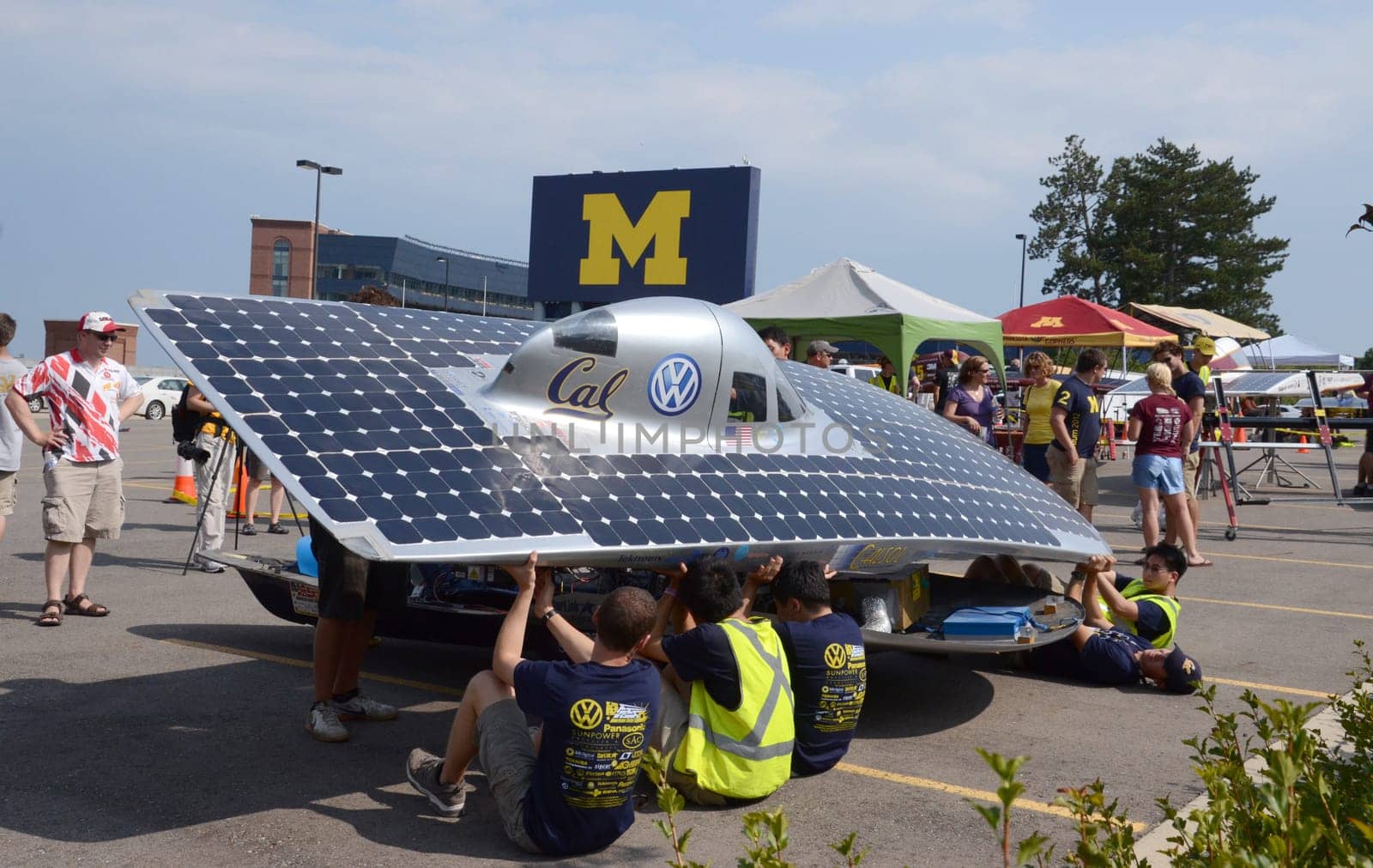 ANN ARBOR, MI - JULY 16: University of California Berkeley's solar car team members recharging their car at the American Solar Challenge stop July 16, 2012 in Ann Arbor, MI.