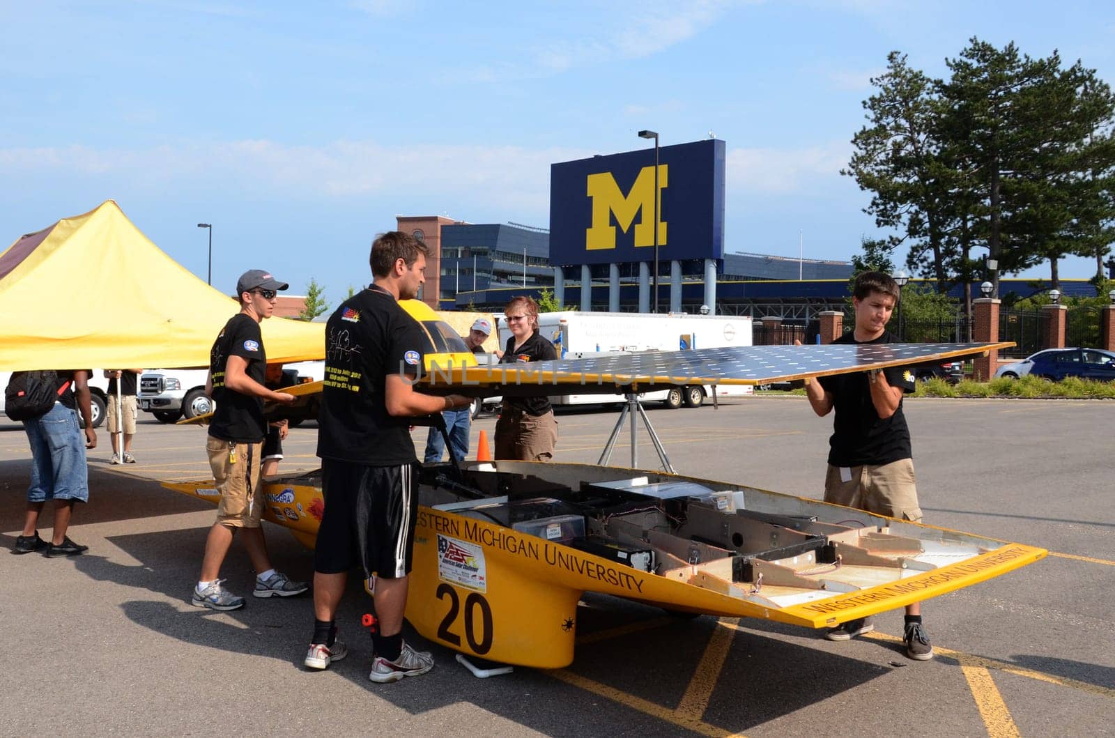 ANN ARBOR, MI - JULY 16: Western Michigan University’s solar car team members dismantling their car at the American Solar Challenge stop July 16, 2012 in Ann Arbor, MI.